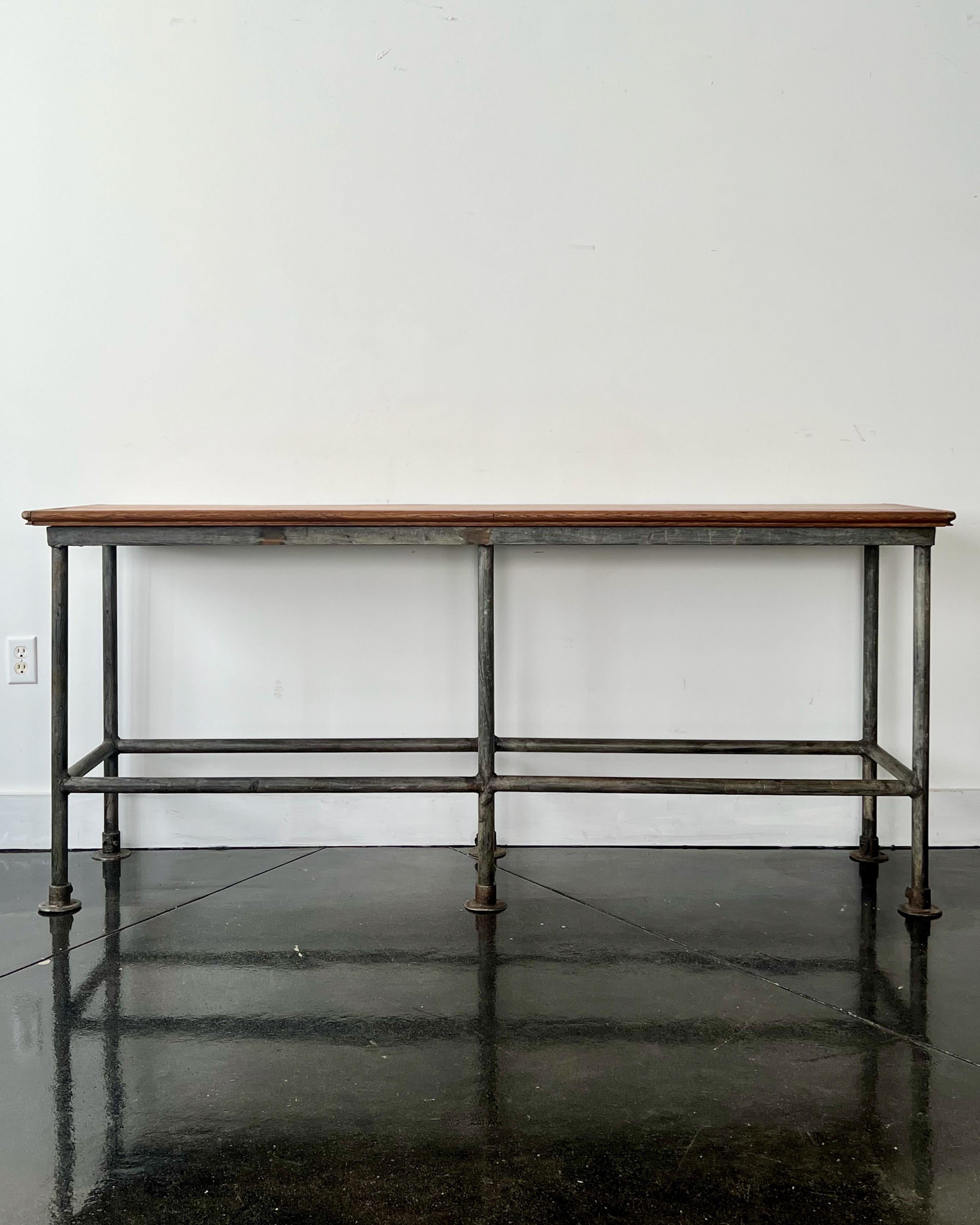 The antique Industrial work table/console table with cast iron base holds solid oak planks top.
With clean lines this table is ideal for many uses:
kitchen work table, hall console, bar table, home office desk etc.

