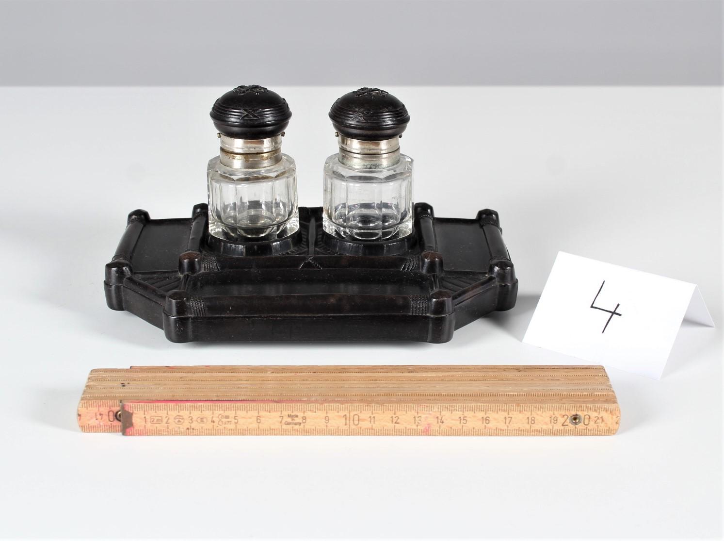 Exceptional Gutta-Percha inkwell with original glass inserts.
 