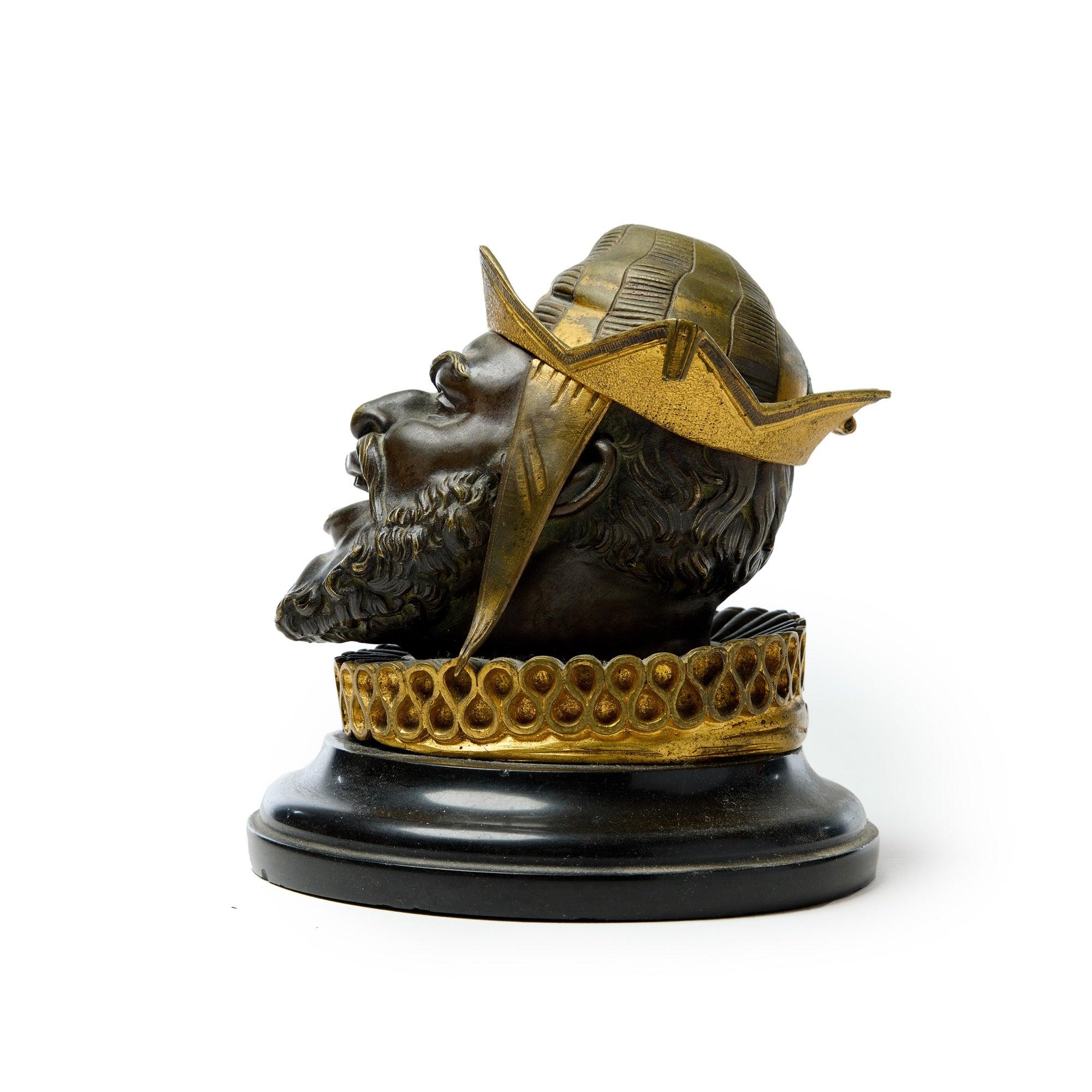 A 19th century bronze inkwell set on a marble base.