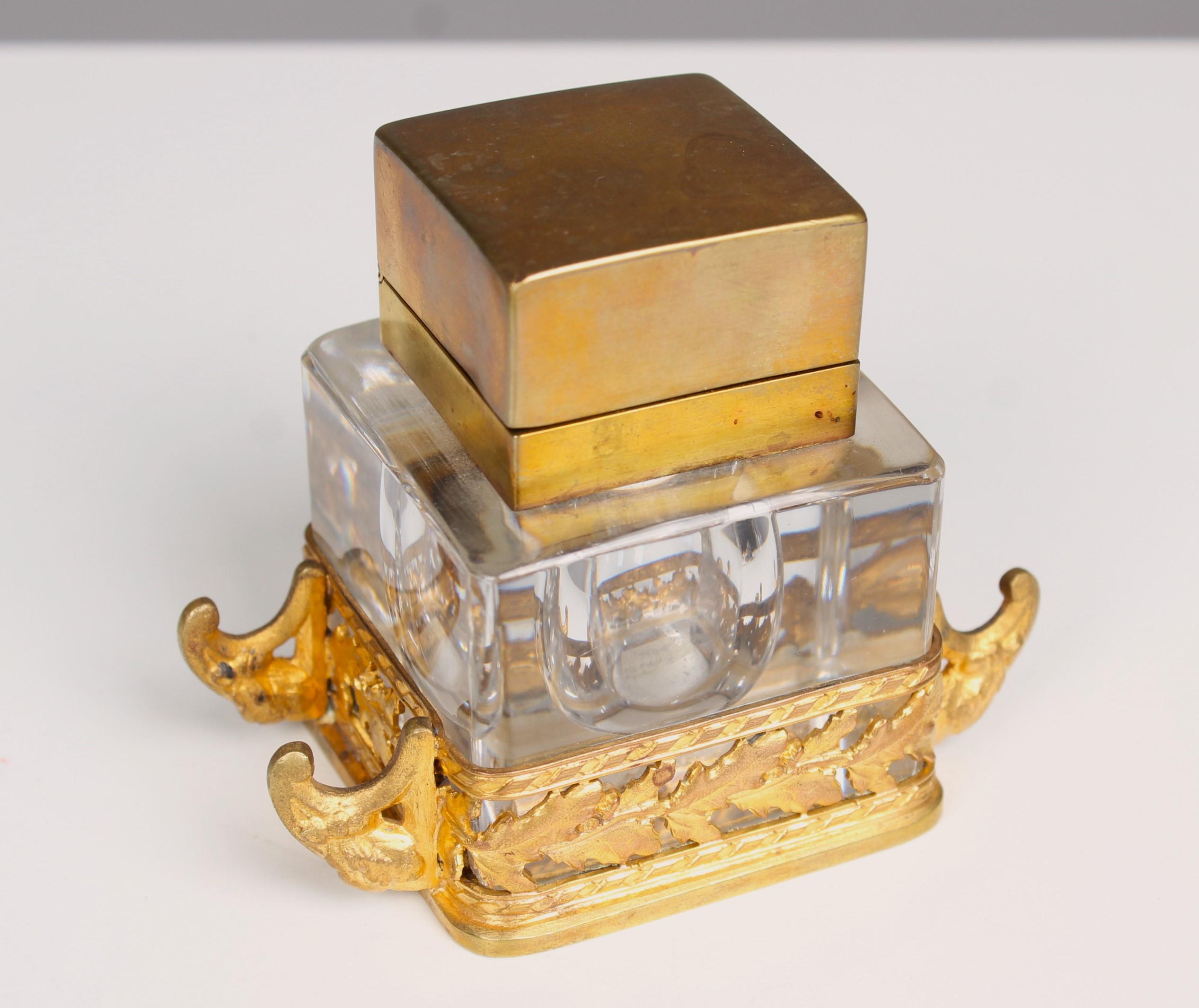 Beautiful antique inkwell, made from glass with brass.
France, circa 1880.




