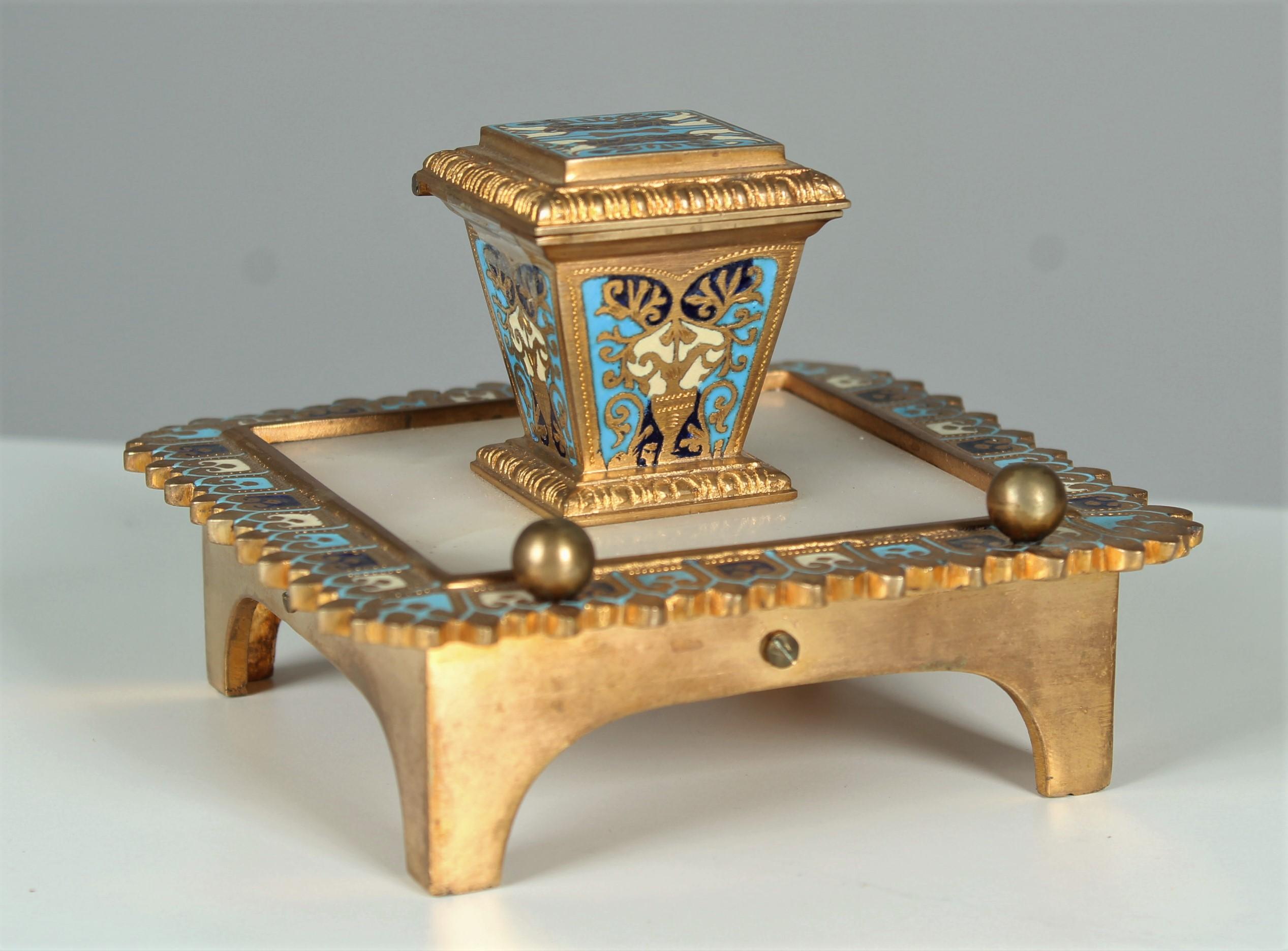 Beautiful antique inkwell made from gilded bronze. 
Nicely coloured ceramic parts.
The plate is made of marble.
Nice bronze work with a well preserved gilding.
The original glass insert is existing.