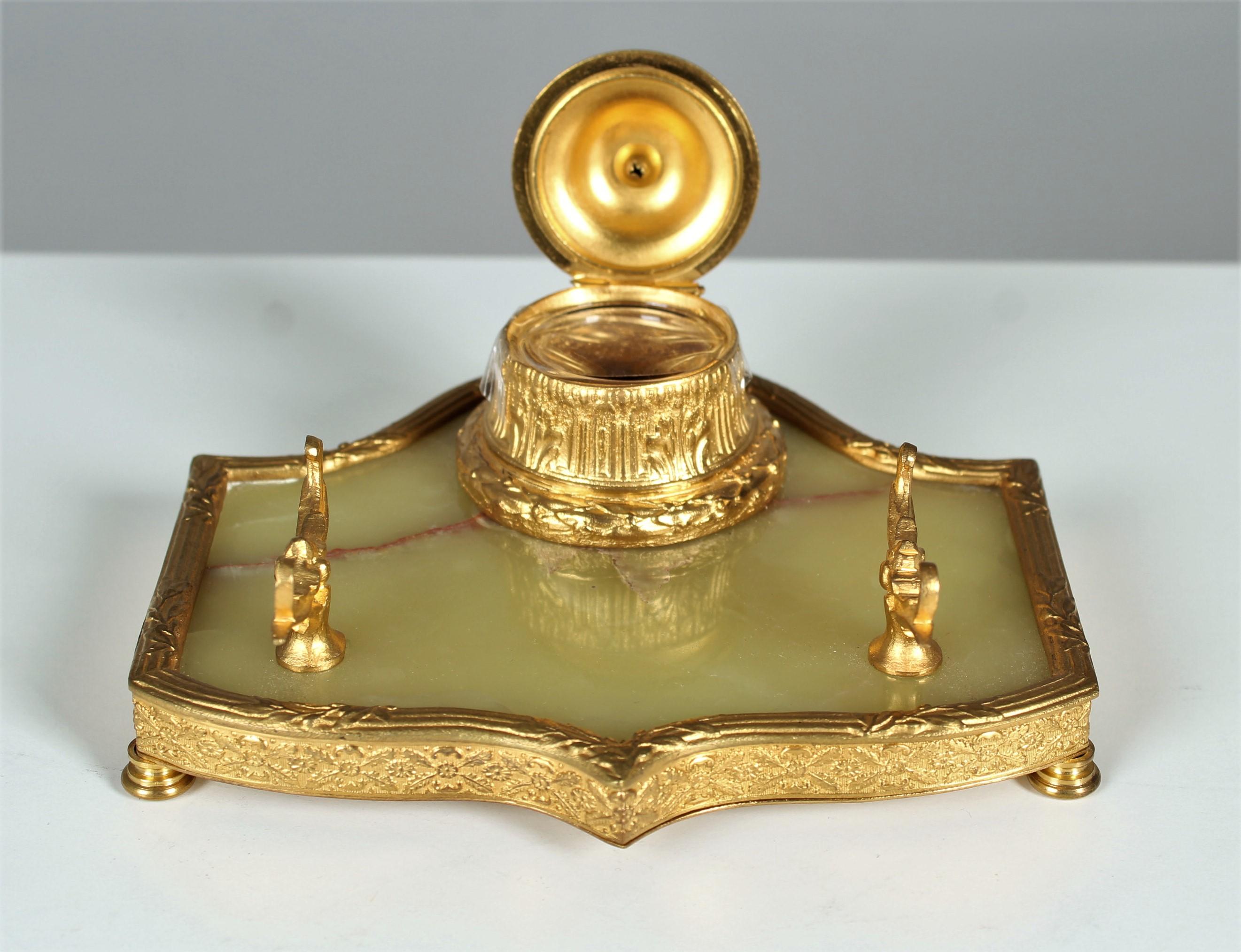 Beautiful antique inkwell made from gilded bronze.
circa 1880.
The plate is made of marble.
Nice bronze work with a well preserved gilding.
The original glass insert is existing.

