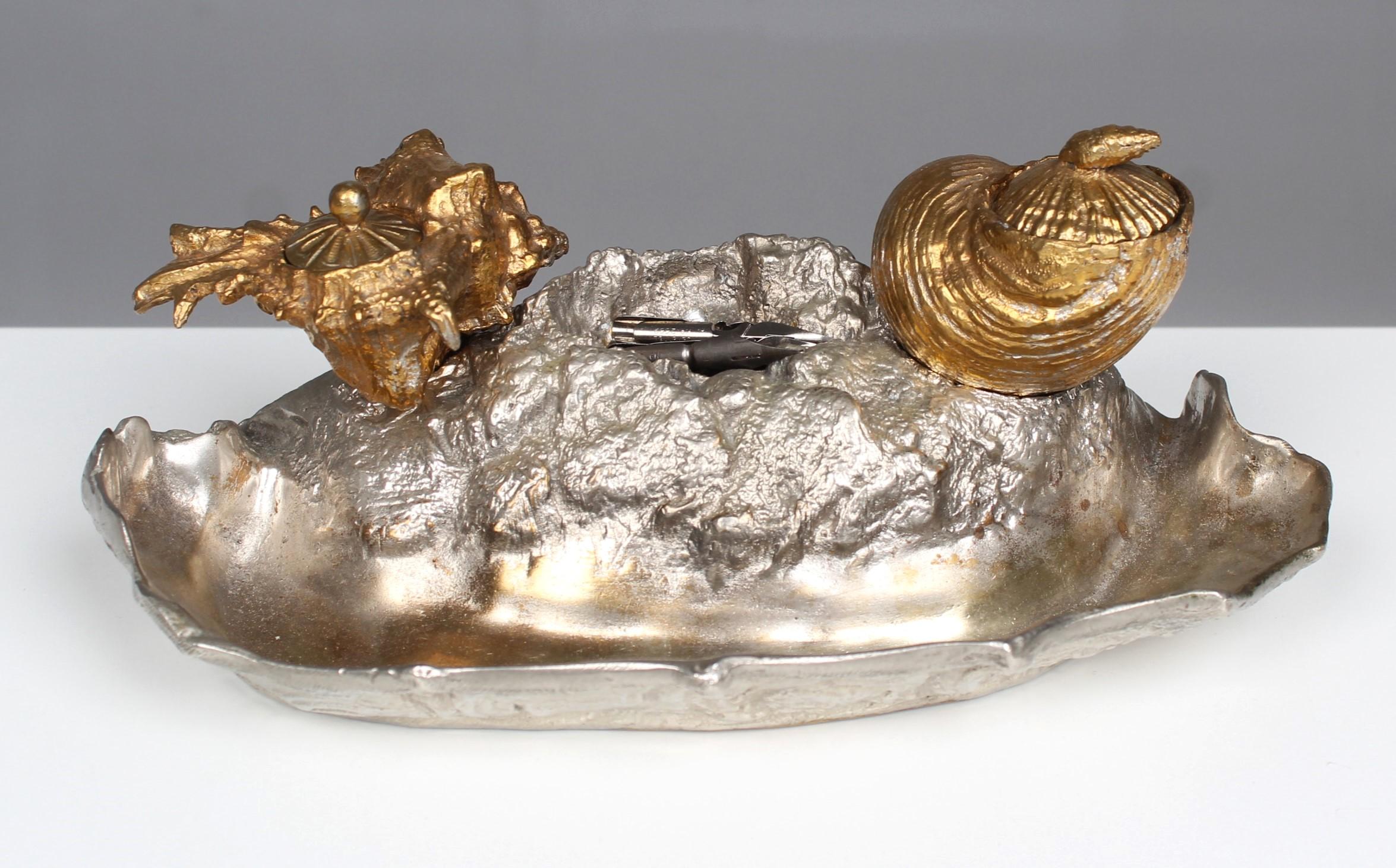 Beautiful antique inkwell from gilded and silvered bronze.
France, mid 19th Century.
Exceptionally beautifully crafted shells as inkwells on a tray as a pen holder, which is depicted as a sandy ground.



