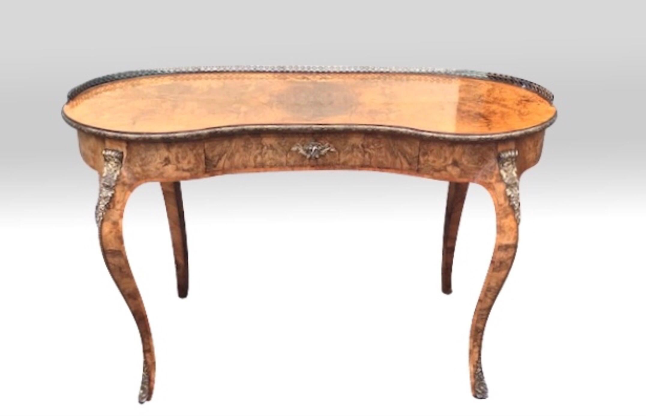 Super quality antique inlaid and marquetry burr walnut kidney shaped table desk
Surmounted with ormolu mounts and brass gallery
C1860
Measures: 44ins x 21ins x 28ins high
112cm x 53.25cm x 71cm.
 