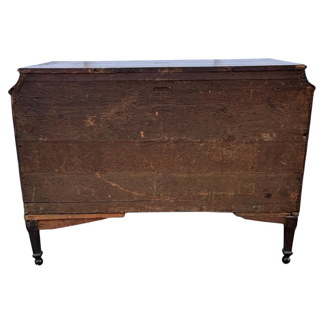 Beautiful inlaid, burled walnut veneered, canted top commode from Venice.  Commode features 4 drawers, is accented with gilded bronze rings and hand-carved, ebonized borders and feet.