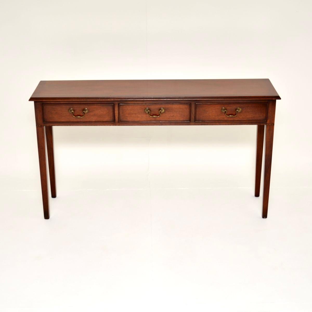 An impressive and very well made antique console table. This was made in England, it dates from around the 1930-50’s.

It is of superb quality, it is a very useful size; quite long, elegant and slender. The top has cross banded edges and beautiful