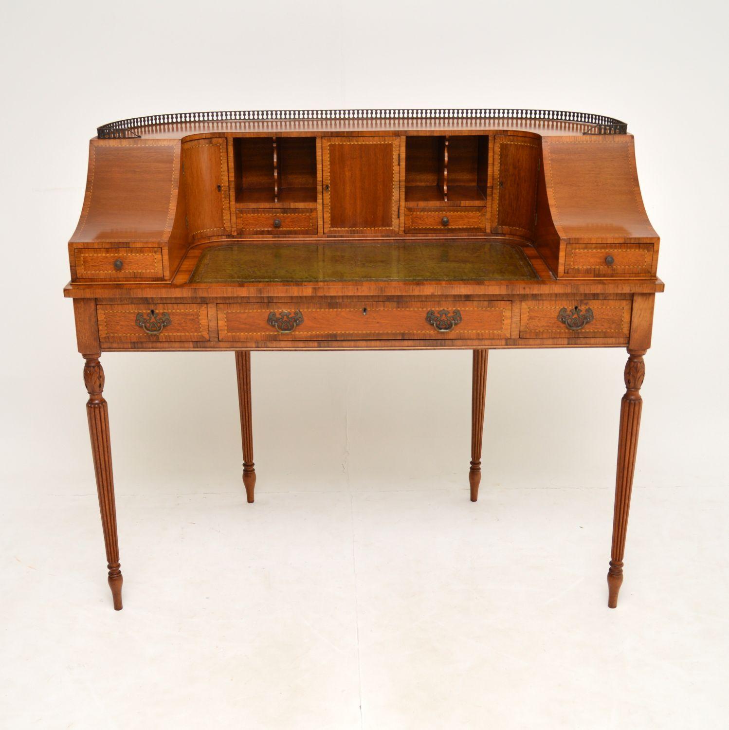 A stunning Carlton house desk, beautifully made from mahogany & walnut, with satinwood inlays. This dates from around the 1950’s period & whoever made this had a very good attention to detail.

It is of extremely fine quality, with many lovely