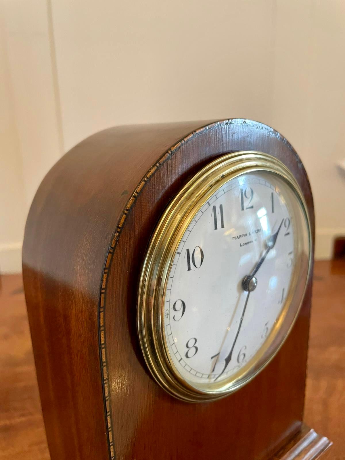 Antique inlaid mahogany mantel clock by Mappin & Webb holders of Royal Warrants to British monarchs since 1897 having a dome top case with pretty chequered inlay, porcelain face with original hands and eight day movement with original brass bezel