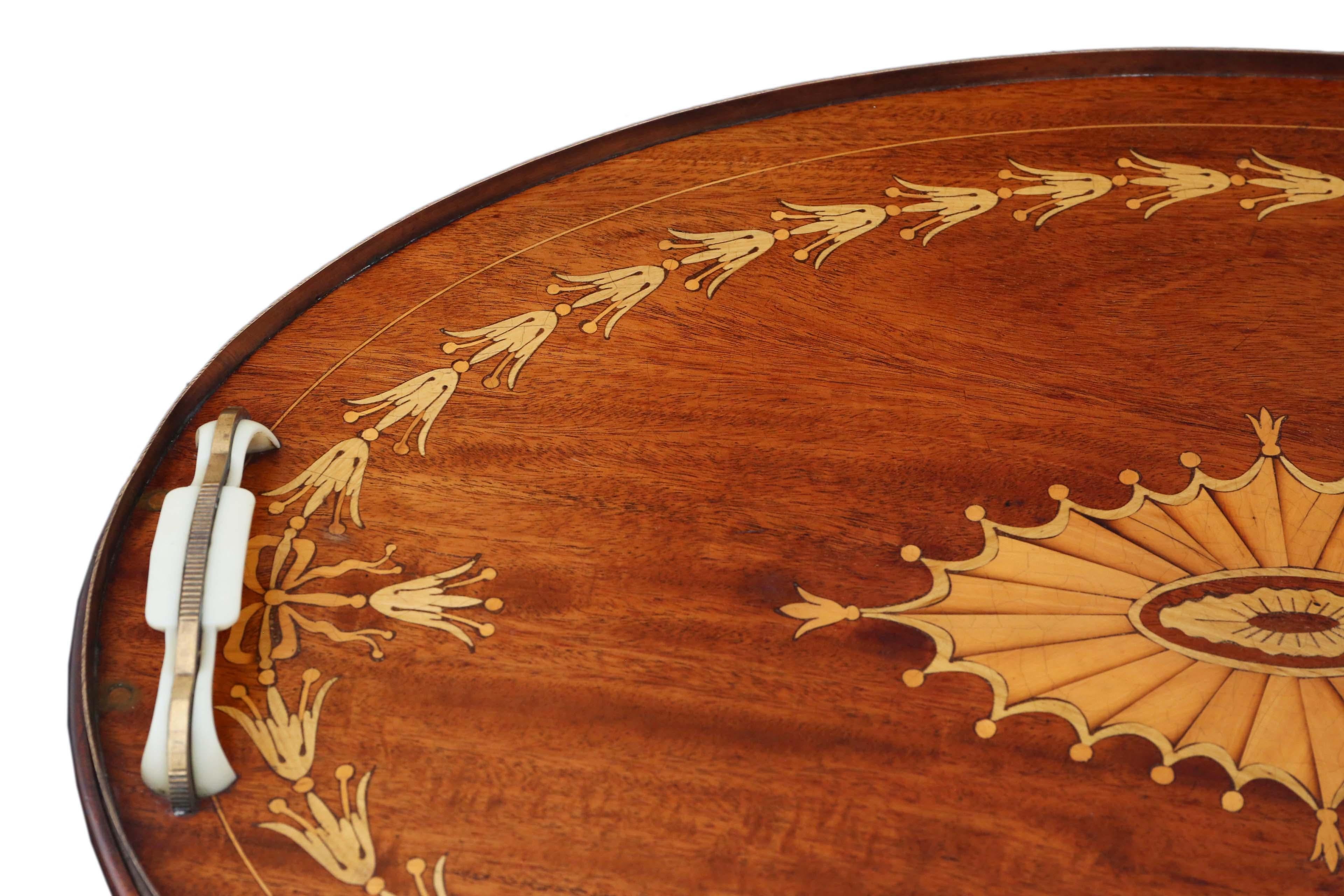 Antique quality inlaid mahogany oval serving tea tray, circa 1915.

A great quality tray.... one of the best examples that we have seen.

Very attractive, with lovely proportions and styling.

Desirable oval shape, with fantastic marquetry
