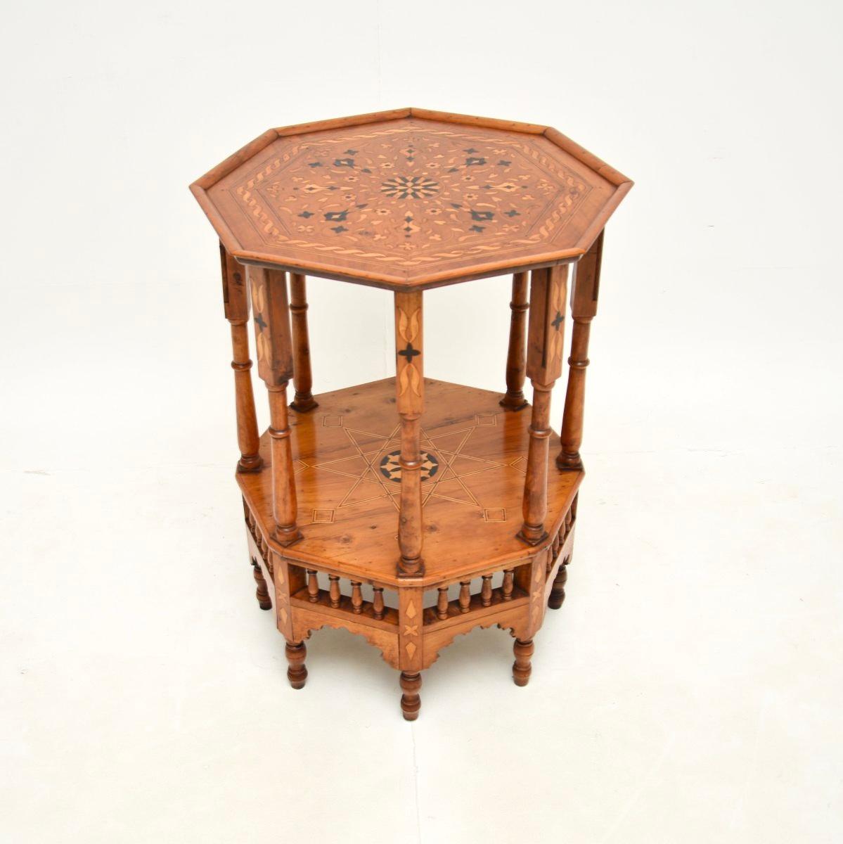 An absolutely stunning antique inlaid olive wood occasional side table. This was made in the middle East, likely Syria, it dates roughly from the 1880’s period, or it could be earlier.

It is of incredibly fine quality, with amazing inlaid patterns