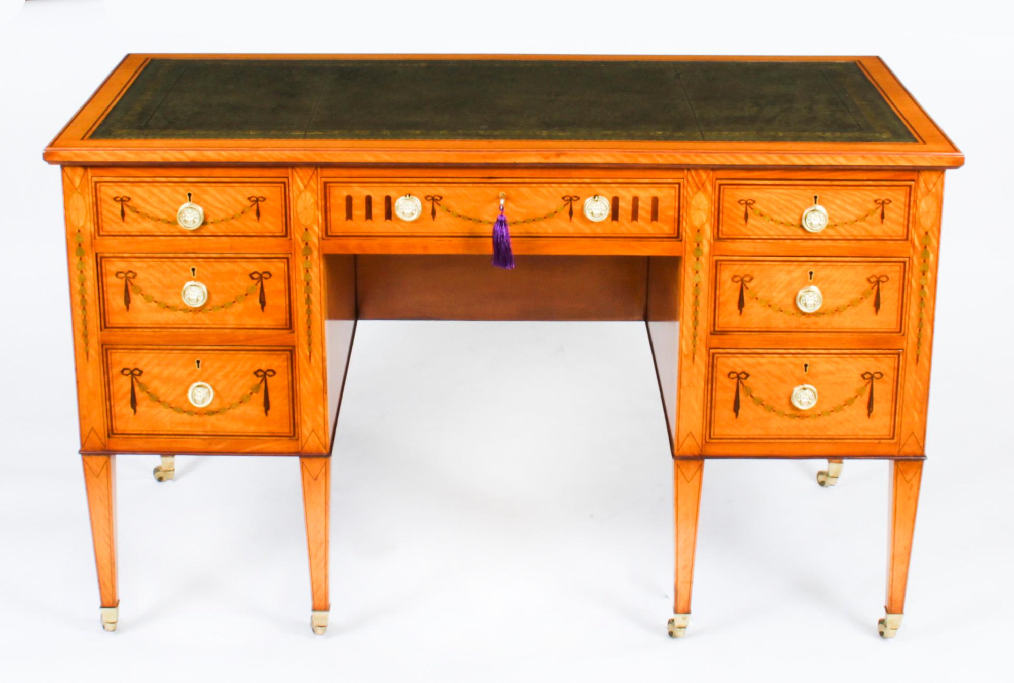 This is a sublime satinwood and marquetry desk by Edwards & Roberts, Circa 1880 in date. 

This gorgeous desk is freestanding and has been crafted from beautiful satinwood which has been masterfully inlaid with a marquetry of ribbons, swags and
