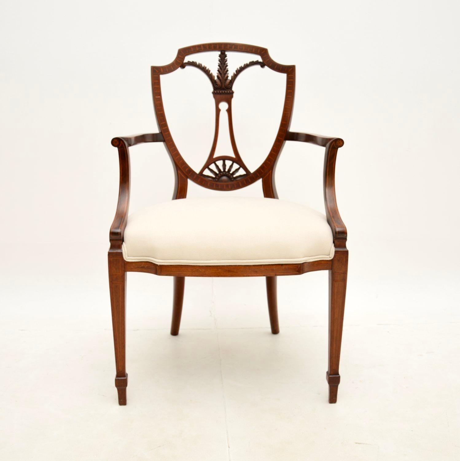 A stunning antique carver armchair. This was made in England, it is in the Sheraton style and dates from around the 1900-1910 period.

The quality is outstanding, the frame has a gorgeous, elegant design. The pierced back has intricate carving, the