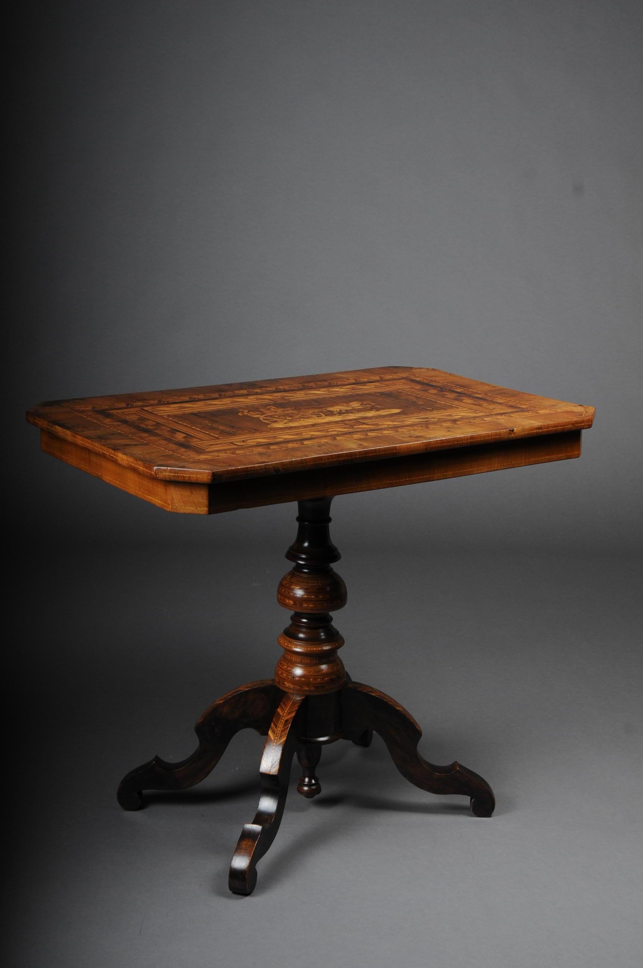 Antique inlaid table South German / Italy, circa 1845
Solid wood, walnut with maple inlays. Also in the center figurative scenery inlaid. Rectangular cover plate on baluster-shaped shaft which is also richly inlaid. Extremely high quality and rich