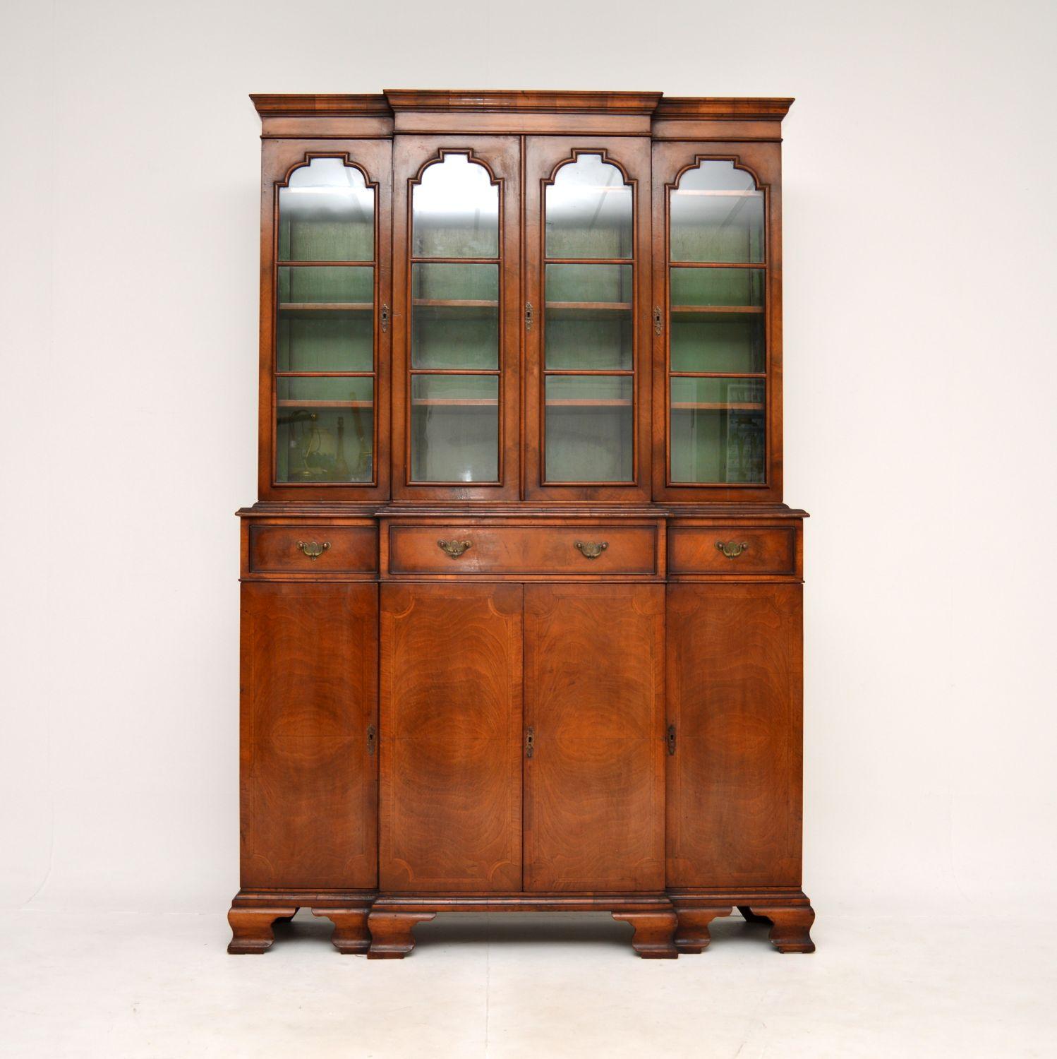 A superb antique inlaid walnut breakfront bookcase. This was made in England, it dates from around the 1900-1910 period.

It is of outstanding quality and is a great size. It is large and has plenty of storage space, it is also quite slim and not