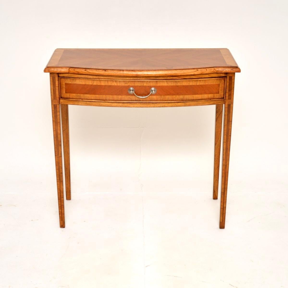 A smart and very well made antique inlaid walnut console side table, in the Georgian style. This was made in England, it dates from around the 1950’s.

It is of outstanding quality and is a very useful, petite size. The walnut has a gorgeous colour