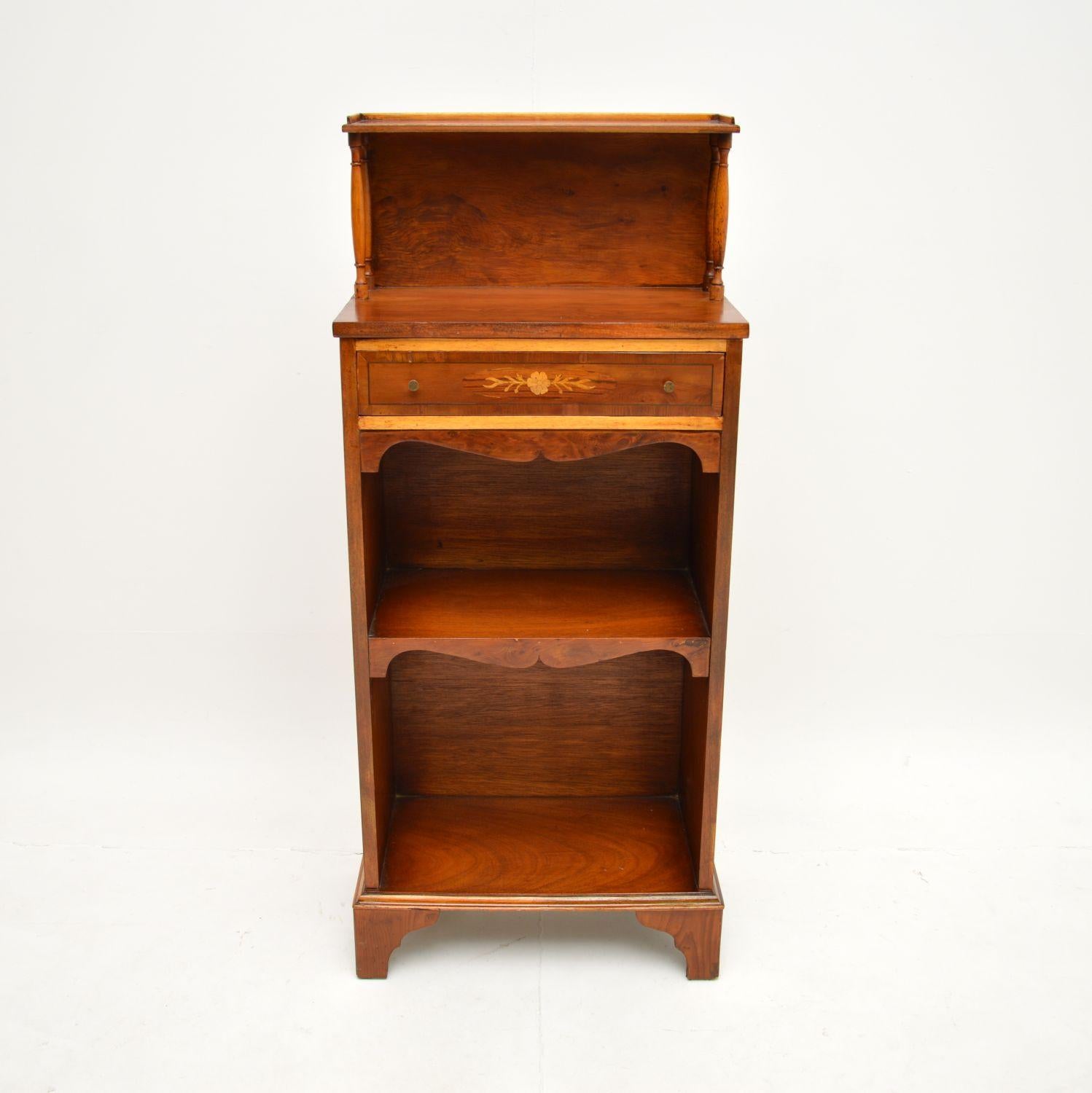 A smart and very useful antique inlaid yew wood open bookcase. This was made in England, it dates from around the 1950’s.

It is very well made and is a great size, slim and narrow with plenty of storage space. The yew wood has a gorgeous colour and
