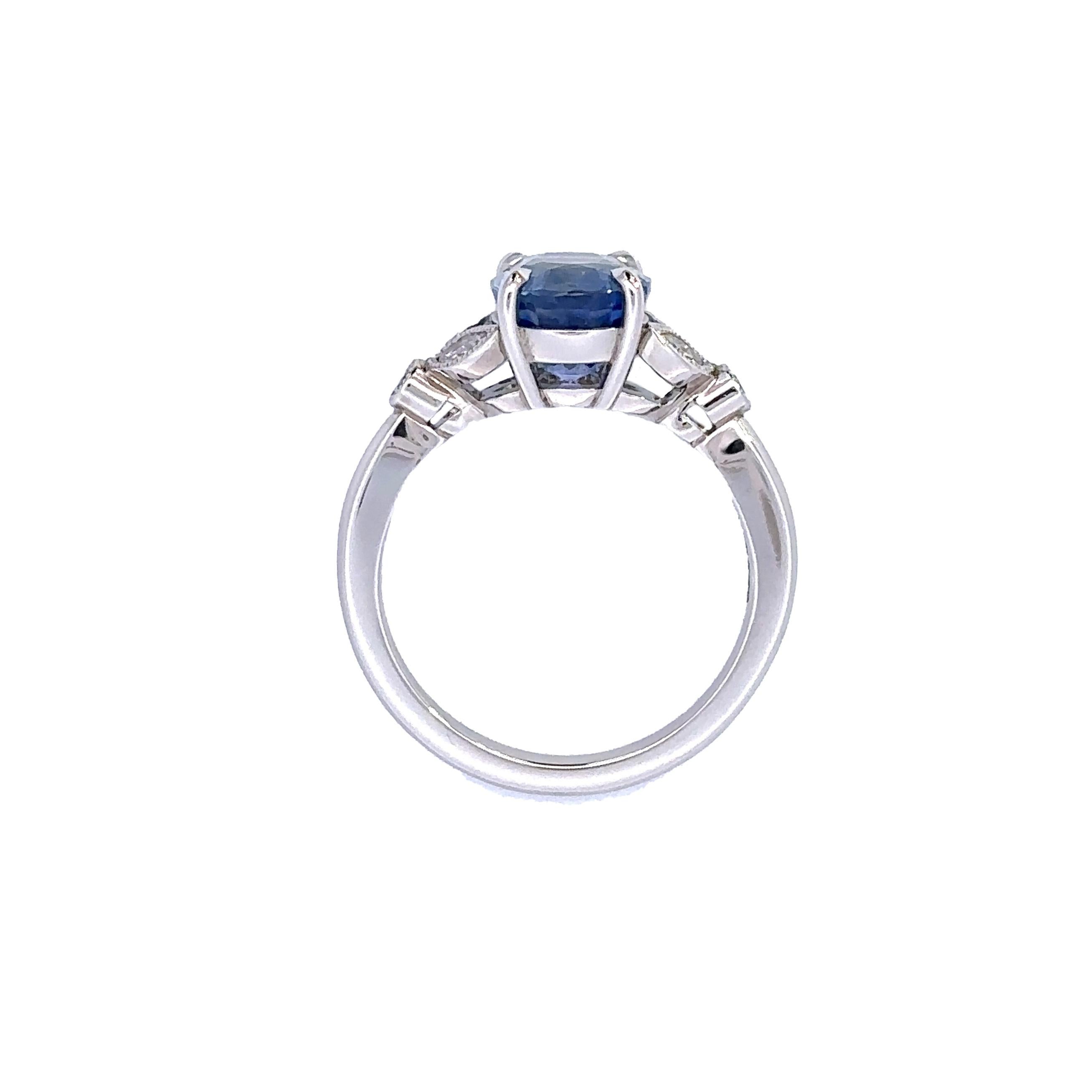 This ring features a stunning oval cornflower blue sapphire framed beautifully on either side by marquise cut diamonds and round brilliant cut diamonds forming a lovely petal detail. 

A soft blue cornflower blue colour that goes with everything,