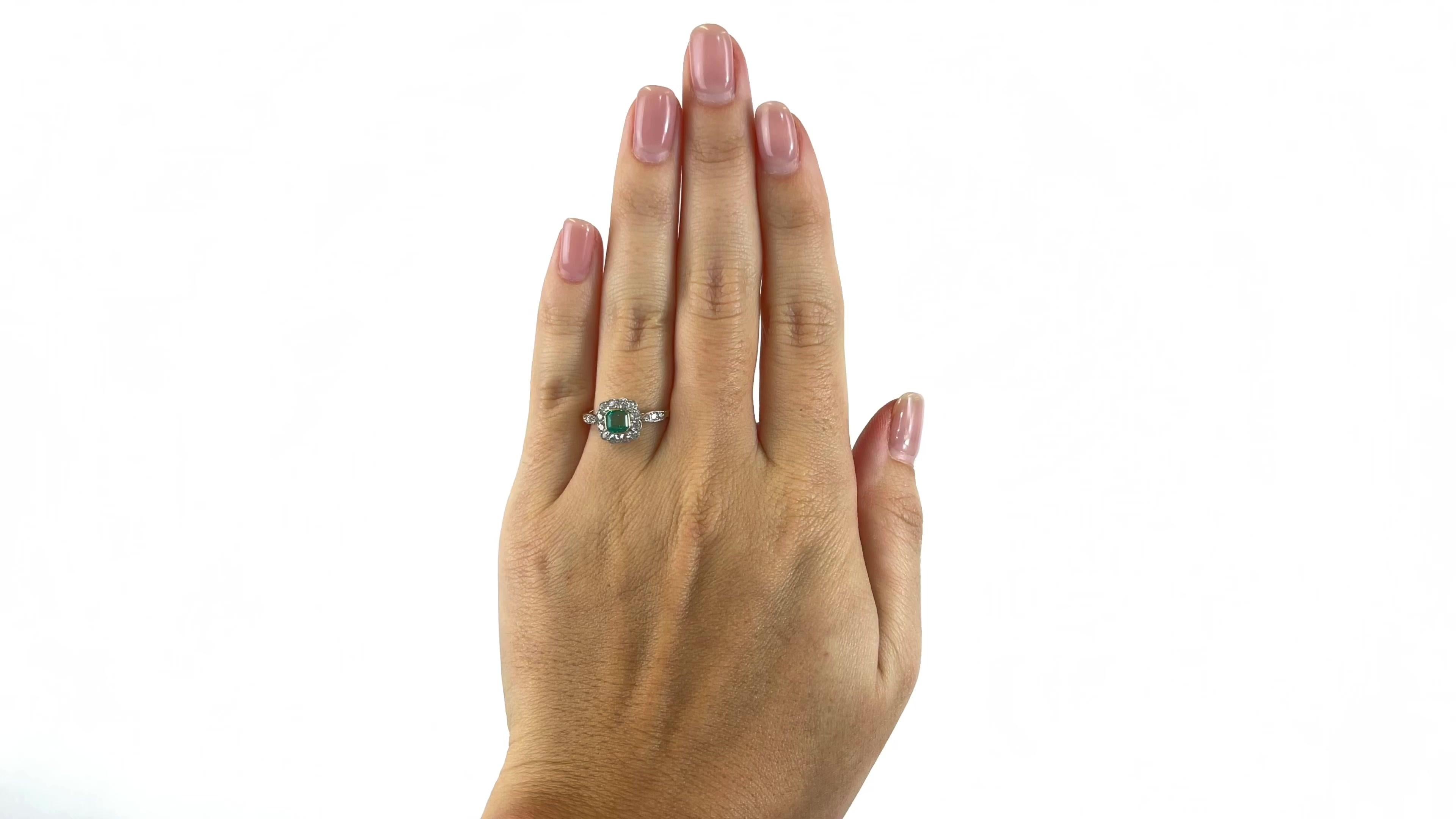 One Antique Inspired Emerald Diamond 18K Gold Ring. Featuring one 0.52 carat step cut emerald. Accented by 18 old European cut diamonds with a total weight of approximately 0.58 carats, graded G color, VS-SI clarity. Crafted in 18 karat yellow gold