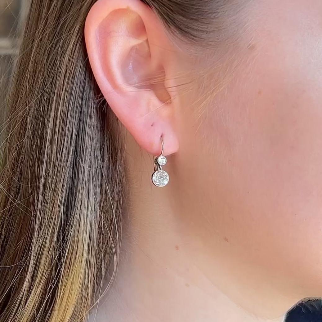 One Pair of Antique Inspired Old Mine Cut Diamond Platinum Drop Earrings. Featuring four old mine cut diamonds with a total weight of 2.02 carats, graded near-colorless, SI clarity. Crafted in platinum with gold backing. Circa 2022. The earrings