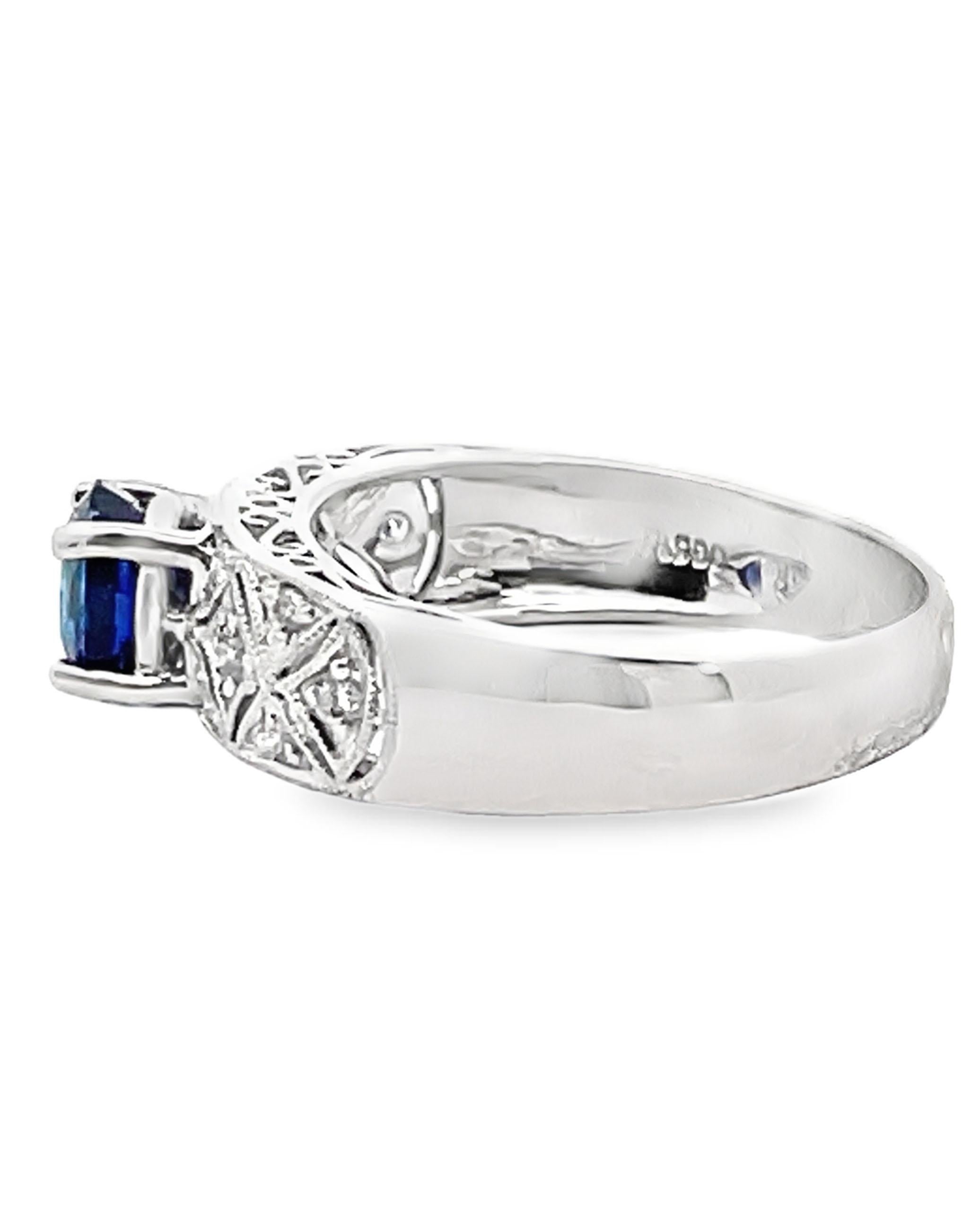 Modern antique inspired platinum ring with 12 round diamonds weighing 0.13 carats total and one center oval sapphire weighing 0.97 carats.

- Finger size 7 
- Diamonds are G/H color, SI clarity
