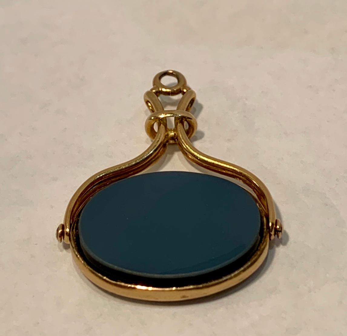 gold spinning fob pendant