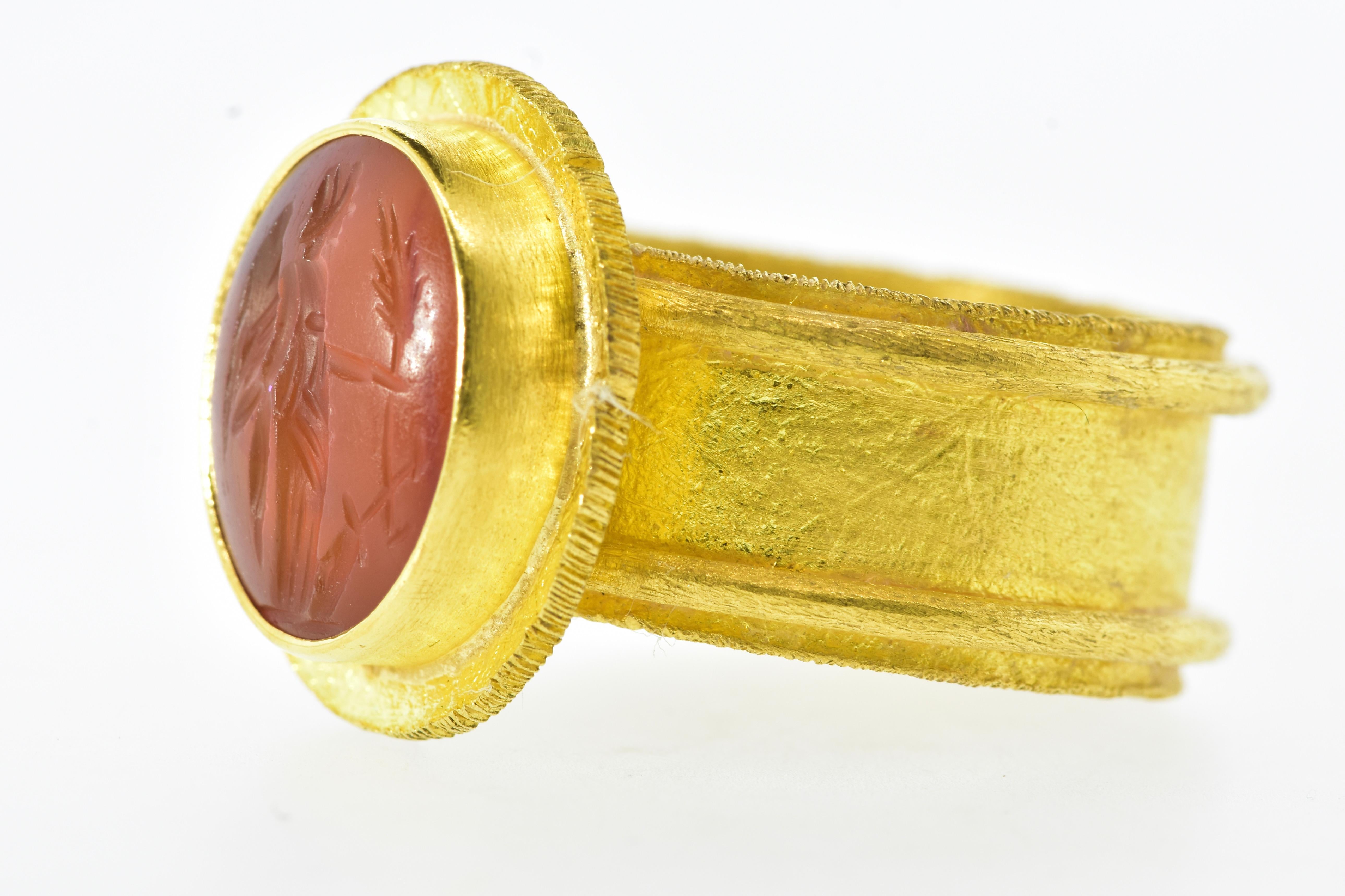 Antique Intaglio set in a 22K Yellow Gold Contemporary Ring For Sale 1