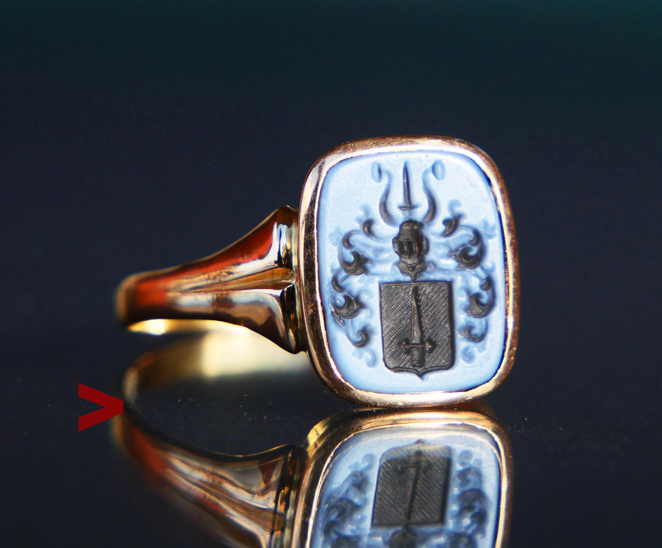 Signet Intaglio Ring featuring banded / two-layered/banded Sardonyx stone with the heraldic depiction of a Sword in the middle of the shield under the Knight's Helmet with horns decorated with plumage. This is a Coat of Arms of the Swedish noble