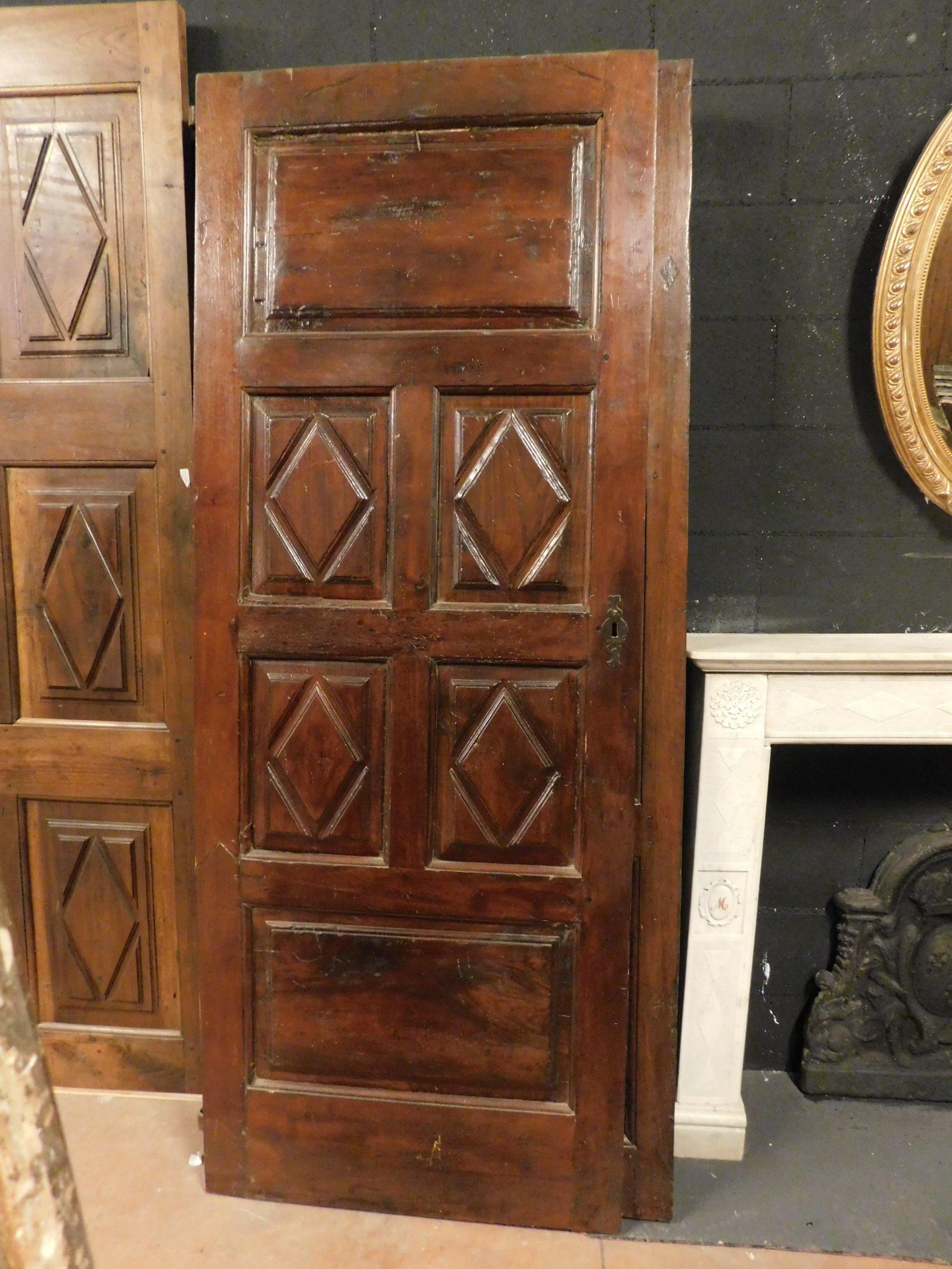 Ancient interior door, built in precious solid walnut wood, decorated with six hand-carved panels, from the full eighteenth century from Italy, from Piedmont, measuring cm w 77 x h 201 x t 3, it was born with opening to push to the left , but it