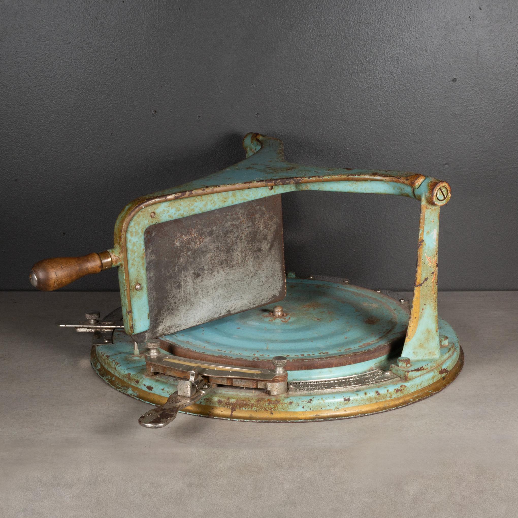 ABOUT

An antique cheese slicer with sharp steel metal cleaver, wooden handle and nickel mounts and scales. A nickel lever and another nickel scale turn the wheel in precise increments for weight and pricing. 

Cast iron with worn original