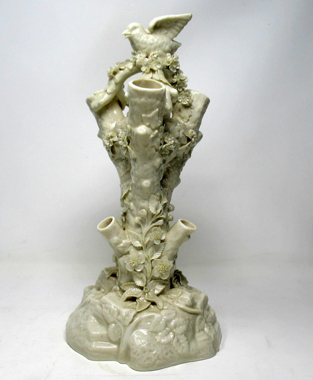 Spectacular Irish Belleek porcelain six branch stump tree vase of outstanding quality. Second Black Mark for dates 1891-1926. 
The main central support modeled as a Tree Trunk with three lower and three upper single flower vase spouts. Also depicts