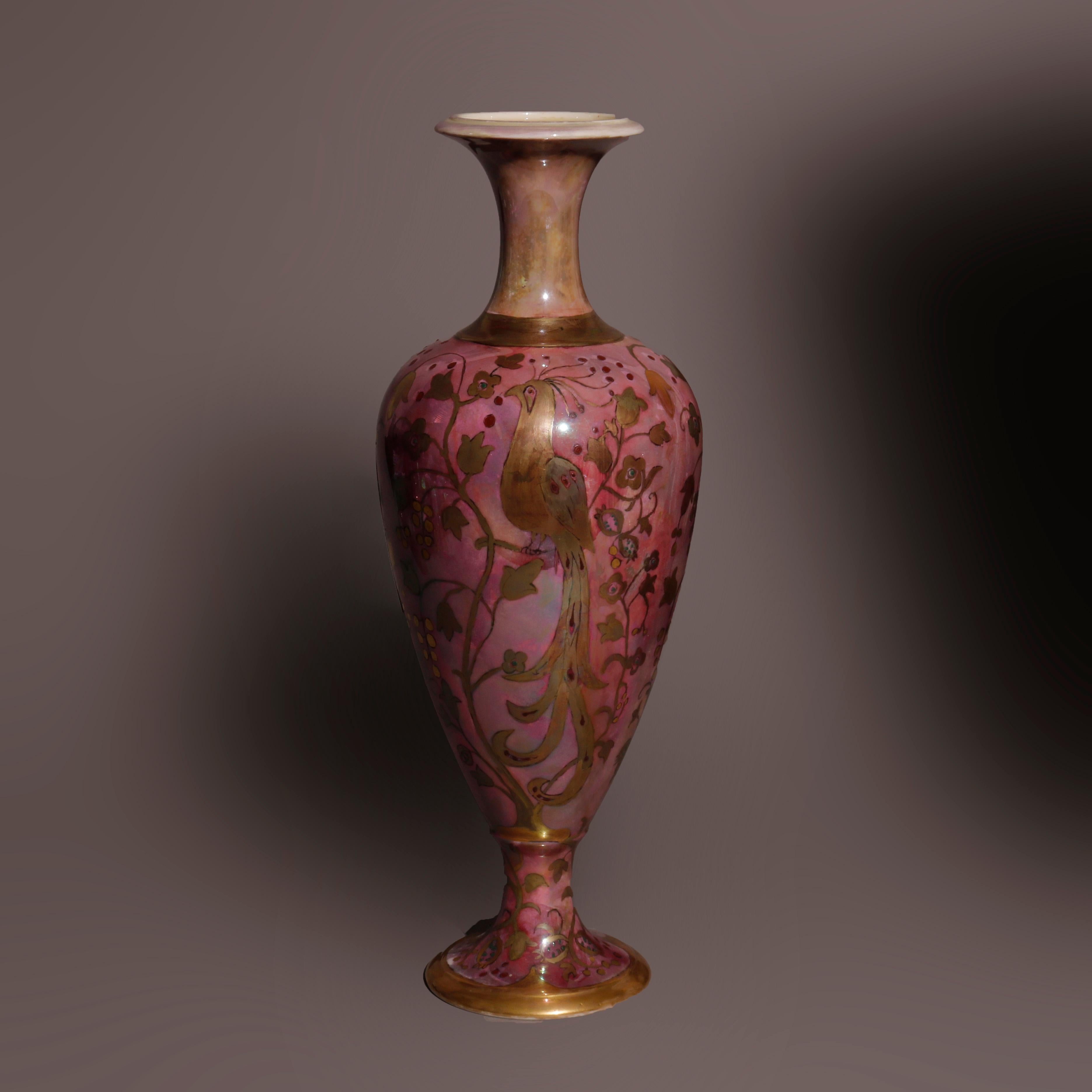 An antique Irish vase by Belleek offers porcelain construction with hand painted and gilt peacock scene, maker mark on base as photographed, c1920

Measures - 17.25''h x 6.25''w x 6.25''d

Catalogue Note: Ask about DISCOUNTED DELIVERY RATES