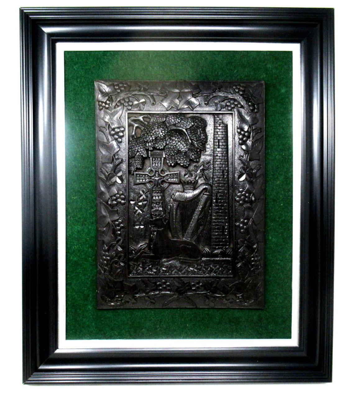 An extremely rare Irish hand carved bog oak framed wall Palque, exquisitely carved in relief, of good size proportions, mid Nineteenth Century, of outstanding quality and condition. 

The central reserve depicting carvings of an Irish Wolfhound,