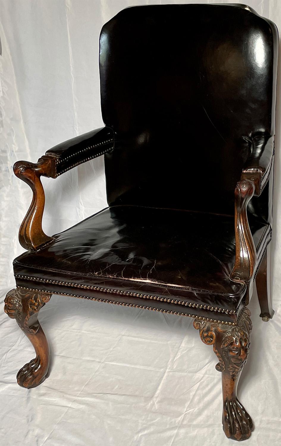 Antique Irish chippendale carved armchair with leather upholstery, circa 1840.