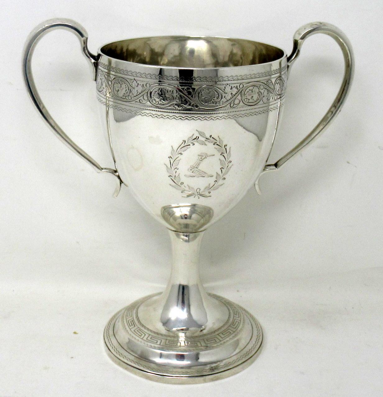 Magnificent large and rare George lll Irish sterling Dublin silver loving cup of large proportions, with twin “C” handles. Engraved Coat of Arms for Trench Family. 

Mark of Daniel Egan. Dublin. Ireland.

Dublin Hallmark for 1807. 

The main outer