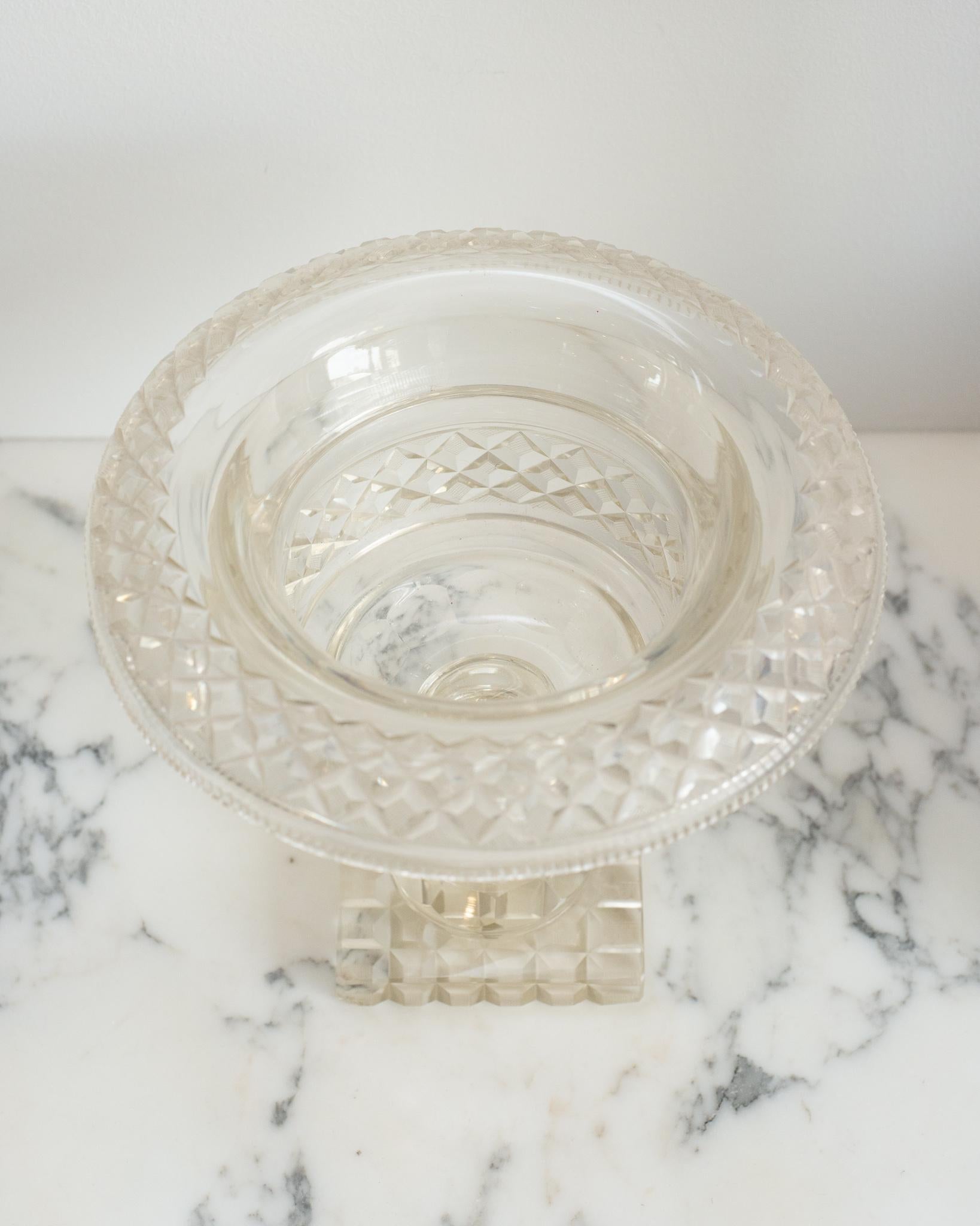 This antique Irish cut crystal decorative bowl with a rolled edge is a Classic accessory that is easy to place in any home. Perfect for serving or decoration, it can be filled fruit or floating flowers.