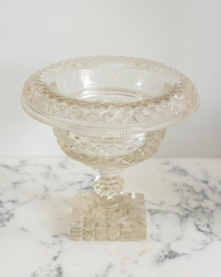 This antique Irish cut crystal decorative bowl with a rolled edge is a Classic accessory that is easy to place in any home. Perfect for serving or decoration, it can be filled fruit or floating flowers.