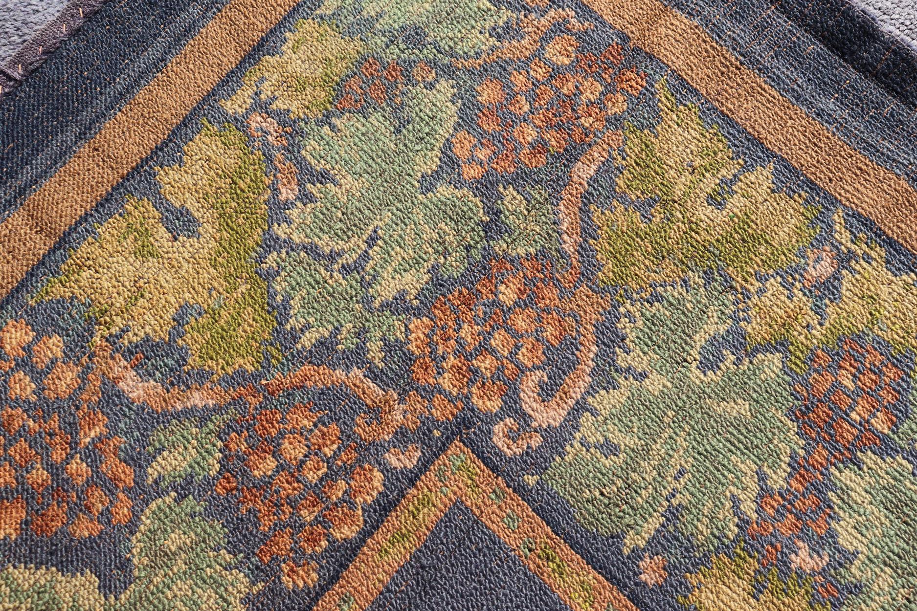 Antique Irish Donegal Carpet On A Solid Purple Background and Floral Border For Sale 7