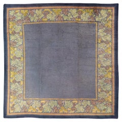 Antique Irish Donegal Carpet On A Solid Purple Background and Floral Border
