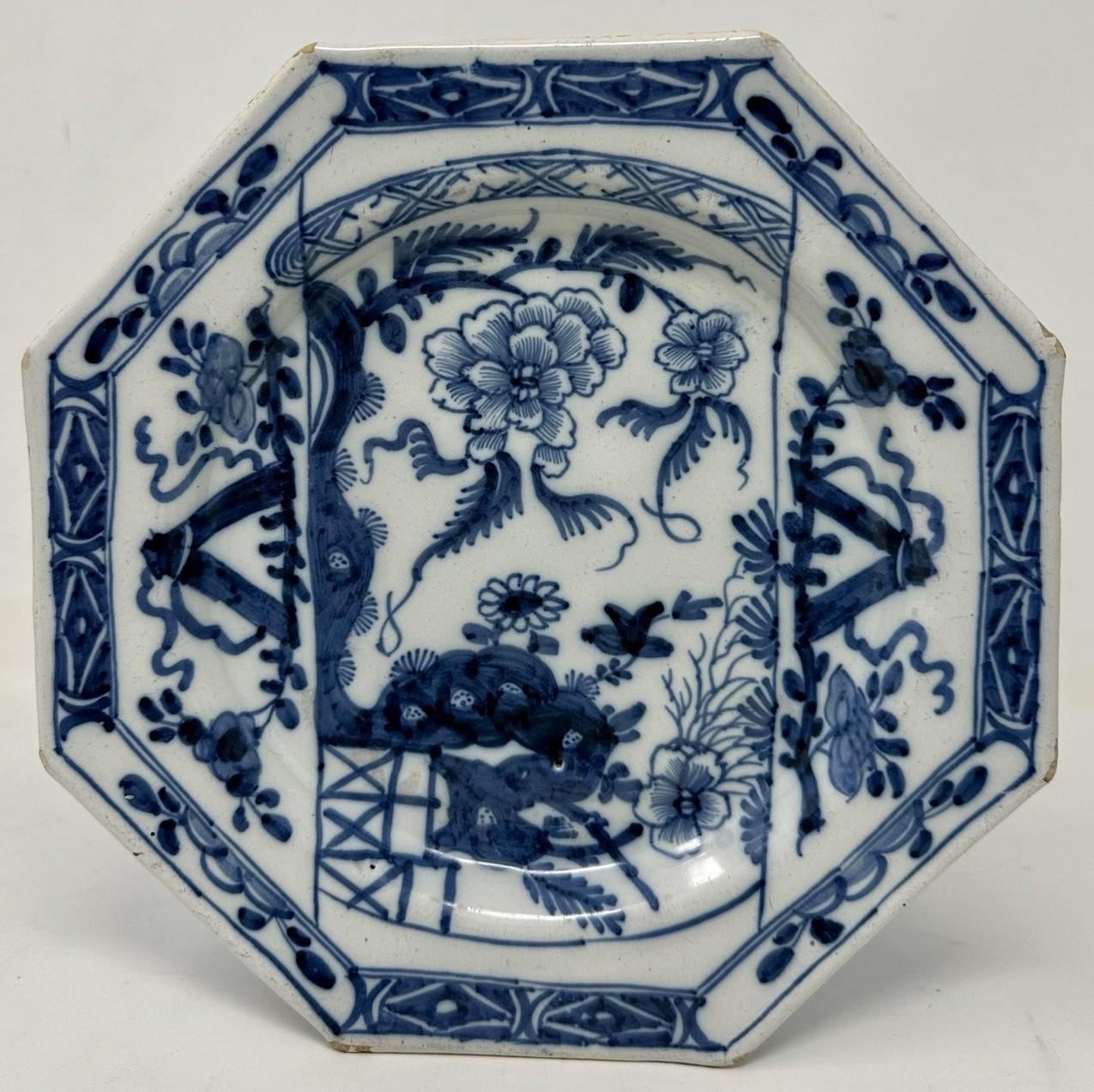 An Extremely Rare Pair Hand Decorated Irish Delft ware wall hanging Charger or Cabinet Dublin Deep Dish Plates by Henry Delamain of seldom seen octagonal form, each similarly decorated with Peony and other flower heads within a decorative border.
