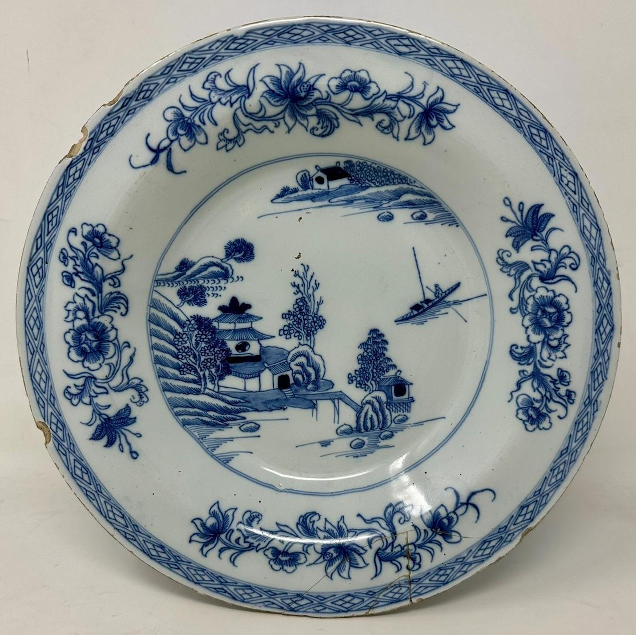 An Extremely Rare Pair Hand Decorated Irish Delft ware wall hanging Chargers or Cabinet Dublin Deep Dish Plates by Henry Delamain of circular form, each similarly decorated with central reserves depicting Chinese Scenes, outer rim areas with