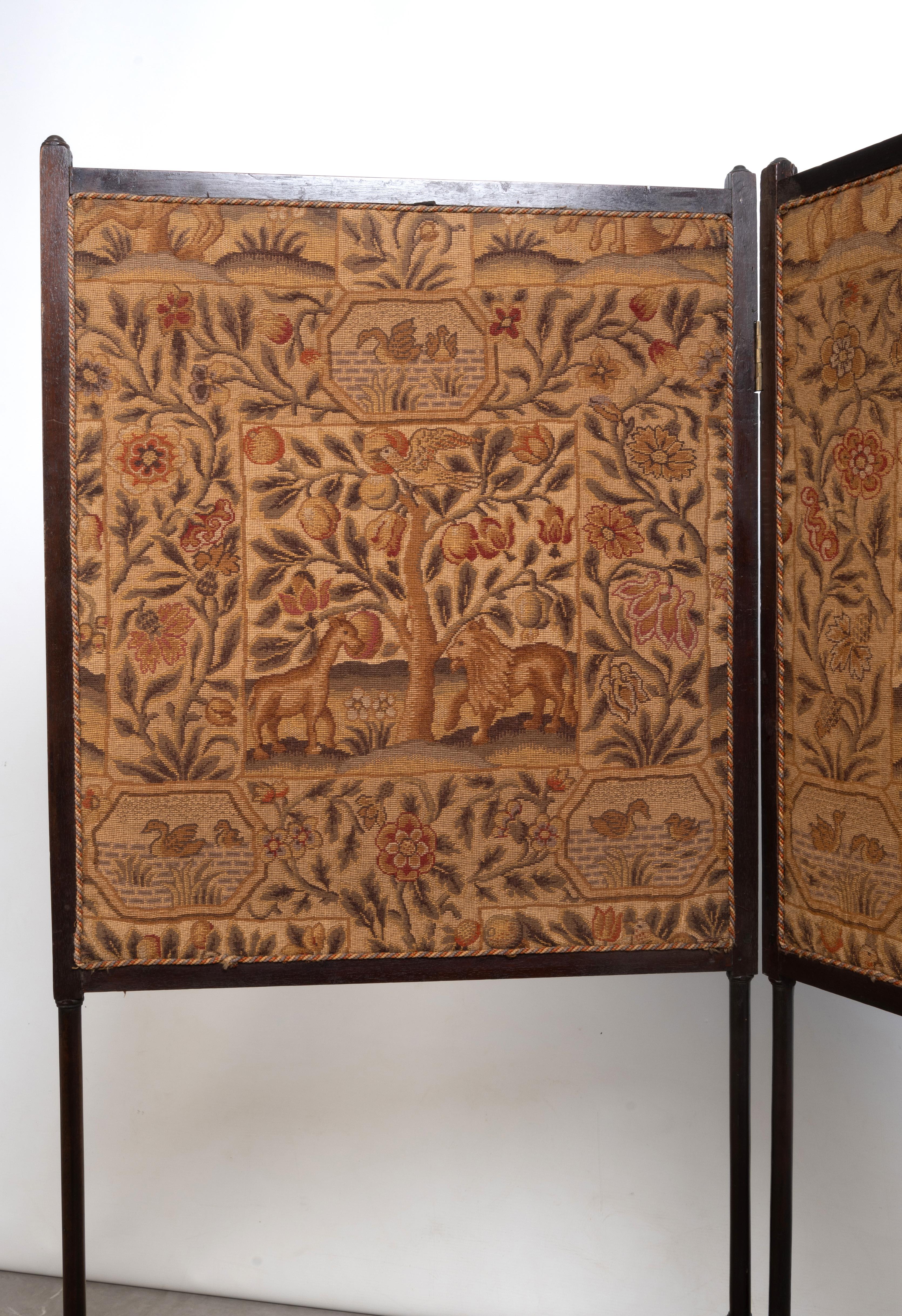ANTIQUE IRISH GEORGE III MAHOGANY TWO-LEAF FIRE SCREEN, CIRCA 1770, set with 19th century needlework panels, the frame raised on turned supports and stretchers.
115cm high x 52cm wide x 2cm deep.

Provenance: Has been on loan to English National