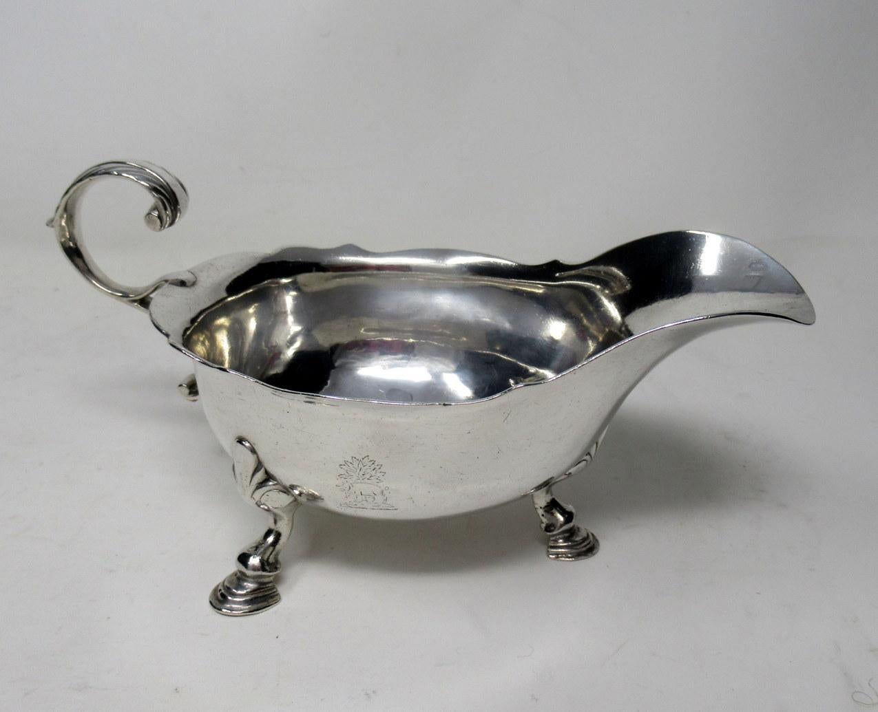 A superb Irish George III crested sterling silver sauce gravy boat of Traditional Helmet Form. Third-quarter of the 18th century. 

With a decorative wavy rim, acanthus wrapped cast s-scroll handle, raised on stylized shell capped legs and feet.