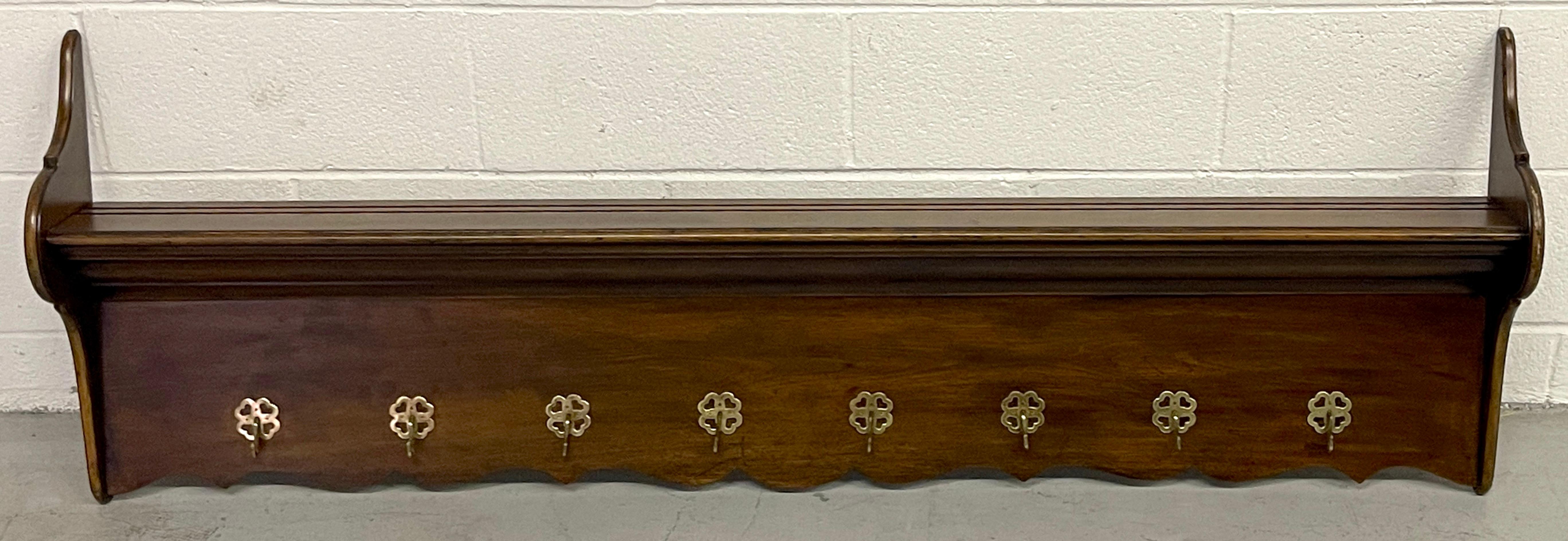 Antique Irish Mahogany & Brass Hanging Coat /Plate Rack or Kitchen Rack 
Circa 1910

Of typical form, Two cabriole end caps supporting a rectangular shelf with two plate grooves one at 1.75 and 2.75 inches deep, the lower scalloped frieze fitted
