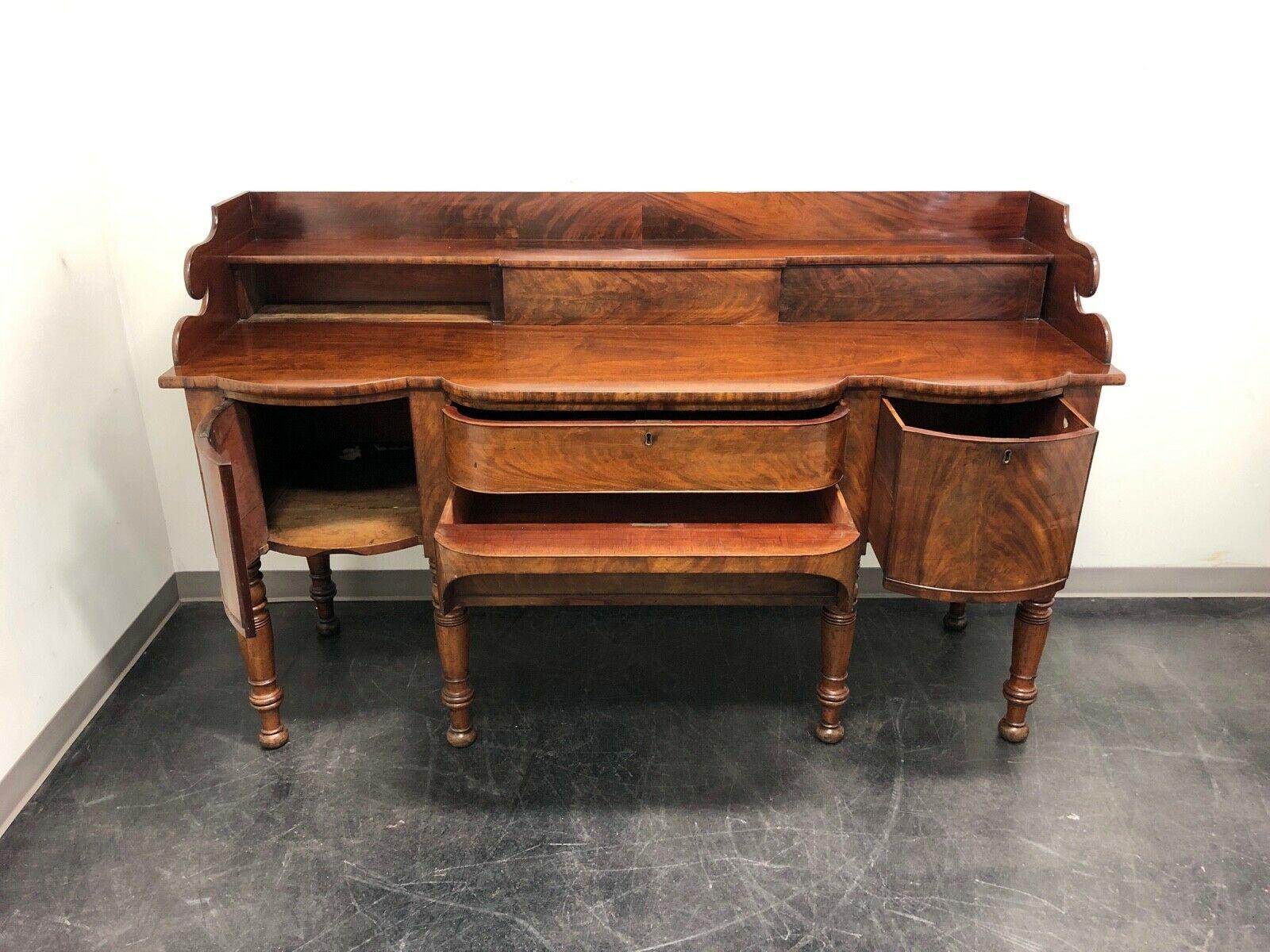 An Irish sideboard in Mahogany, circa 1800. Dovetail construction with turned legs. Purchased from an antique shop in 2003 for $12,000. Made in Ireland.

Measures: Overall: 78 W 28.5 D 48.75 H, Serving surface: 38 H

Good antique condition. Some