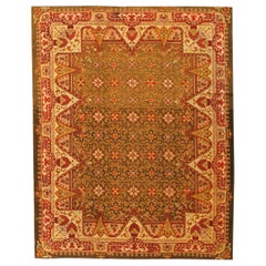 Antique Irish Rug. Size: 6 ft 9 in x 8 ft 6 in (2.06 m x 2.59 m)