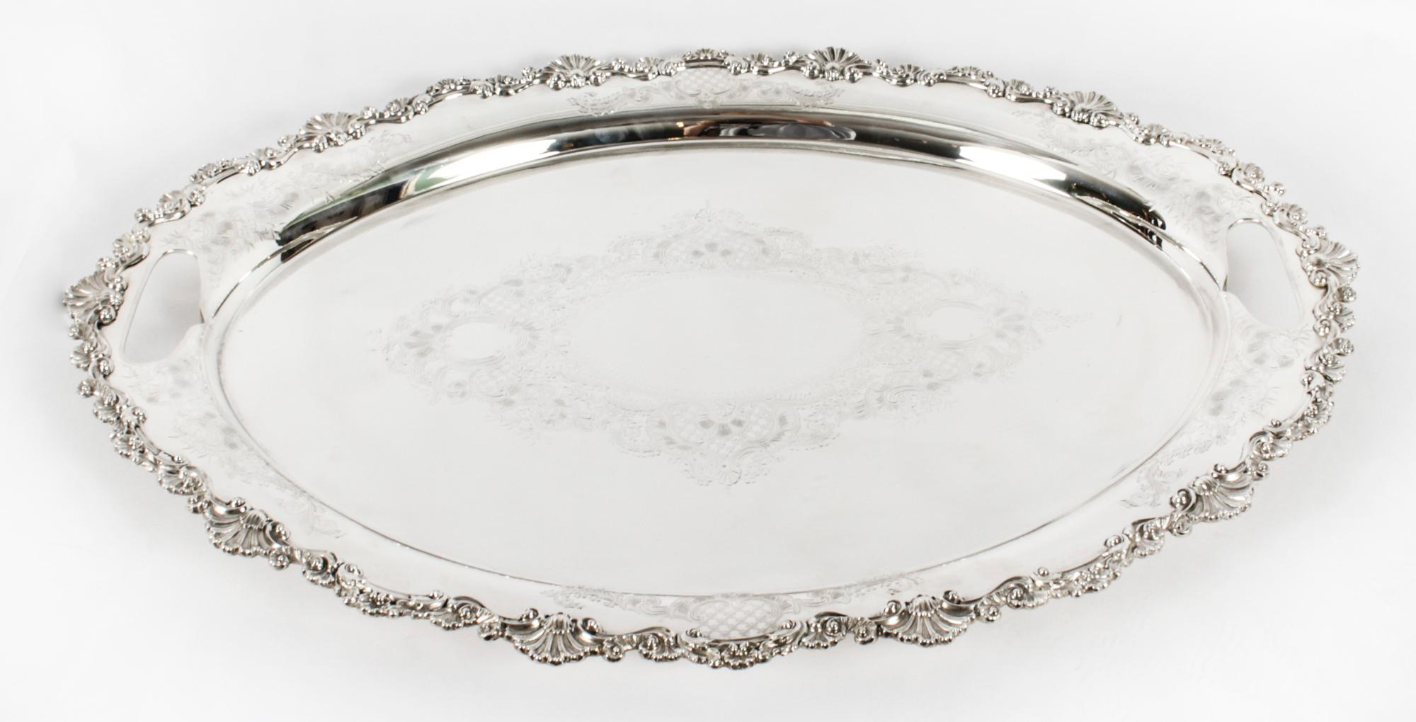 This is a wonderful antique Irish oval silver-plated twin handled tray W. Gibson & Son, Belfast, circa 1870 in date.

This splendid large tray features beautifully engraved floral and foliate decoration. The border and twin handles are embellished