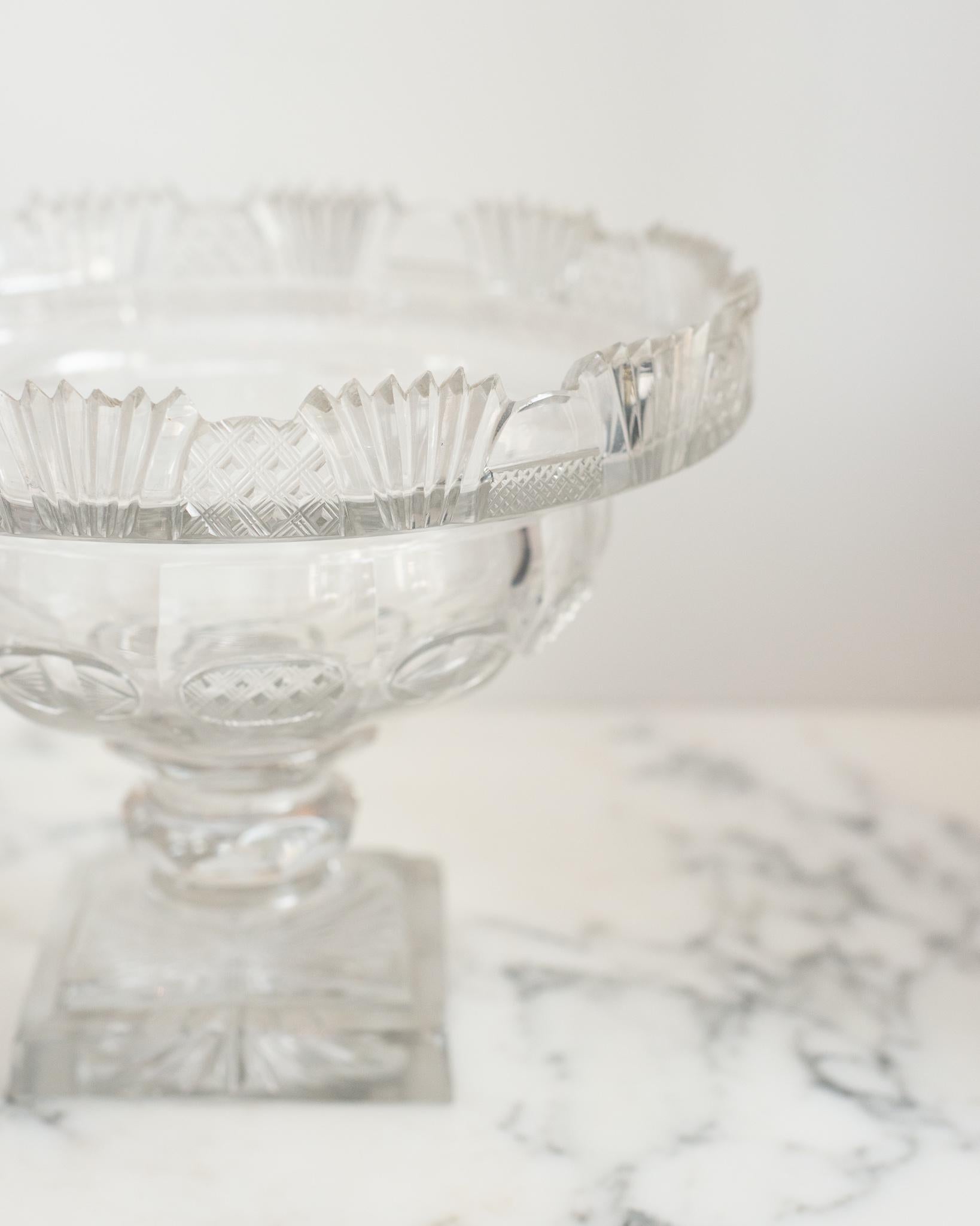This antique Irish small cut crystal decorative bowl is a classic accessory that is easy to place in any home. Perfect for serving or decoration, it can be filled fruit or floating flowers.