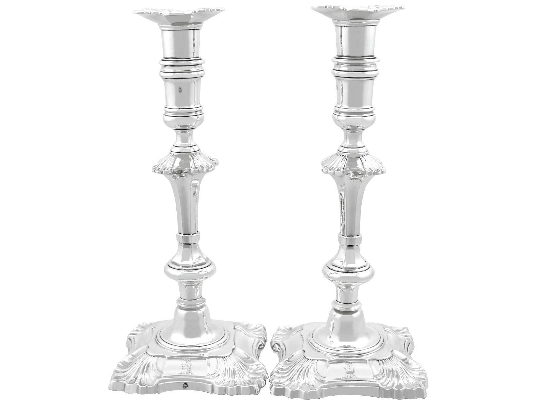 A magnificent, fine and impressive pair of antique Irish cast sterling silver candlesticks; an addition of our ornamental silverware collection.

These exceptional antique cast Irish silver candlesticks, in sterling standard, have a plain