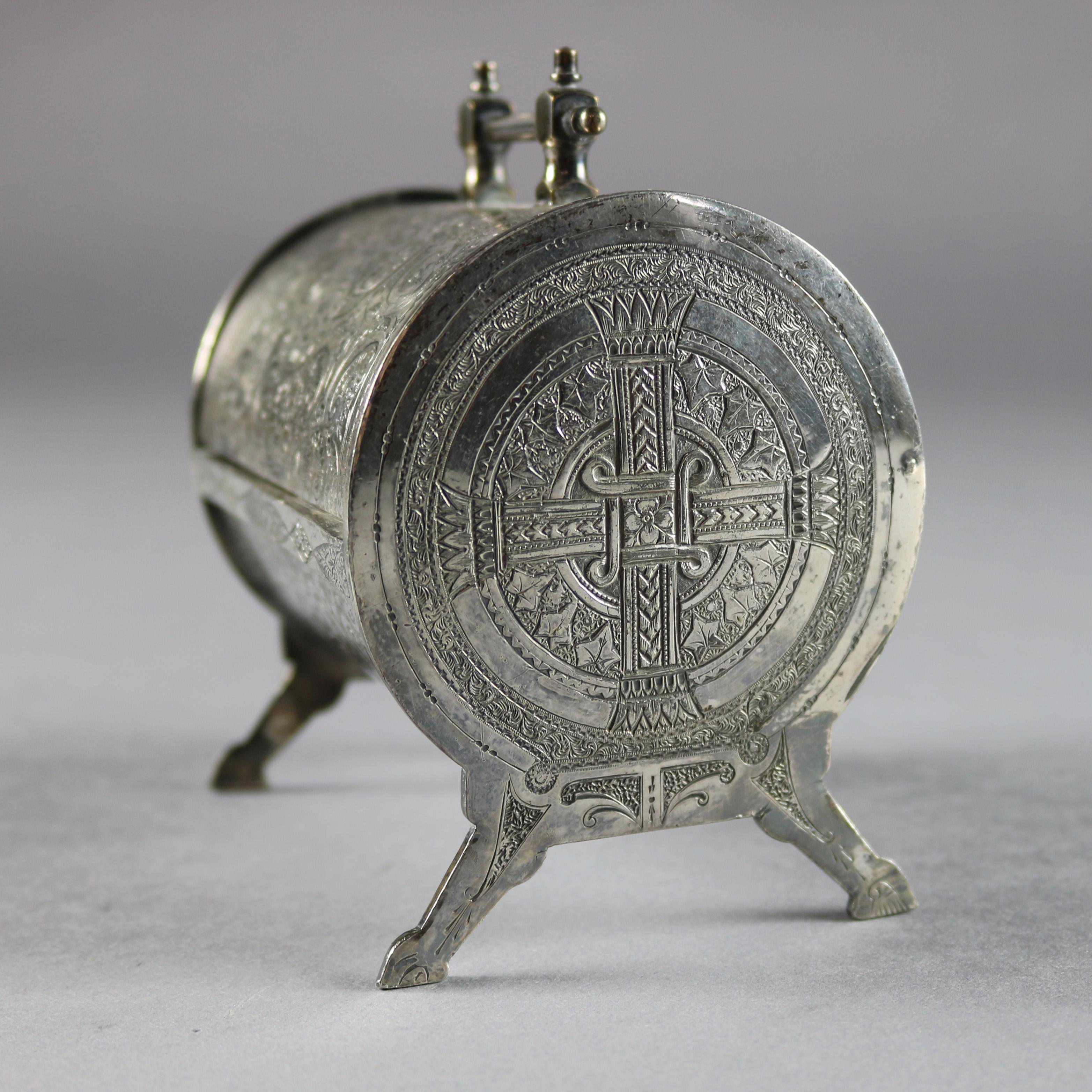 An antique Irish Victorian silver plate jewelry casket features barrel form with etched Celtic and foliate decoration and opening to reveal velvet lined interior, raised on hoof feet and having mortise handle, c1880


Measures - 4.25