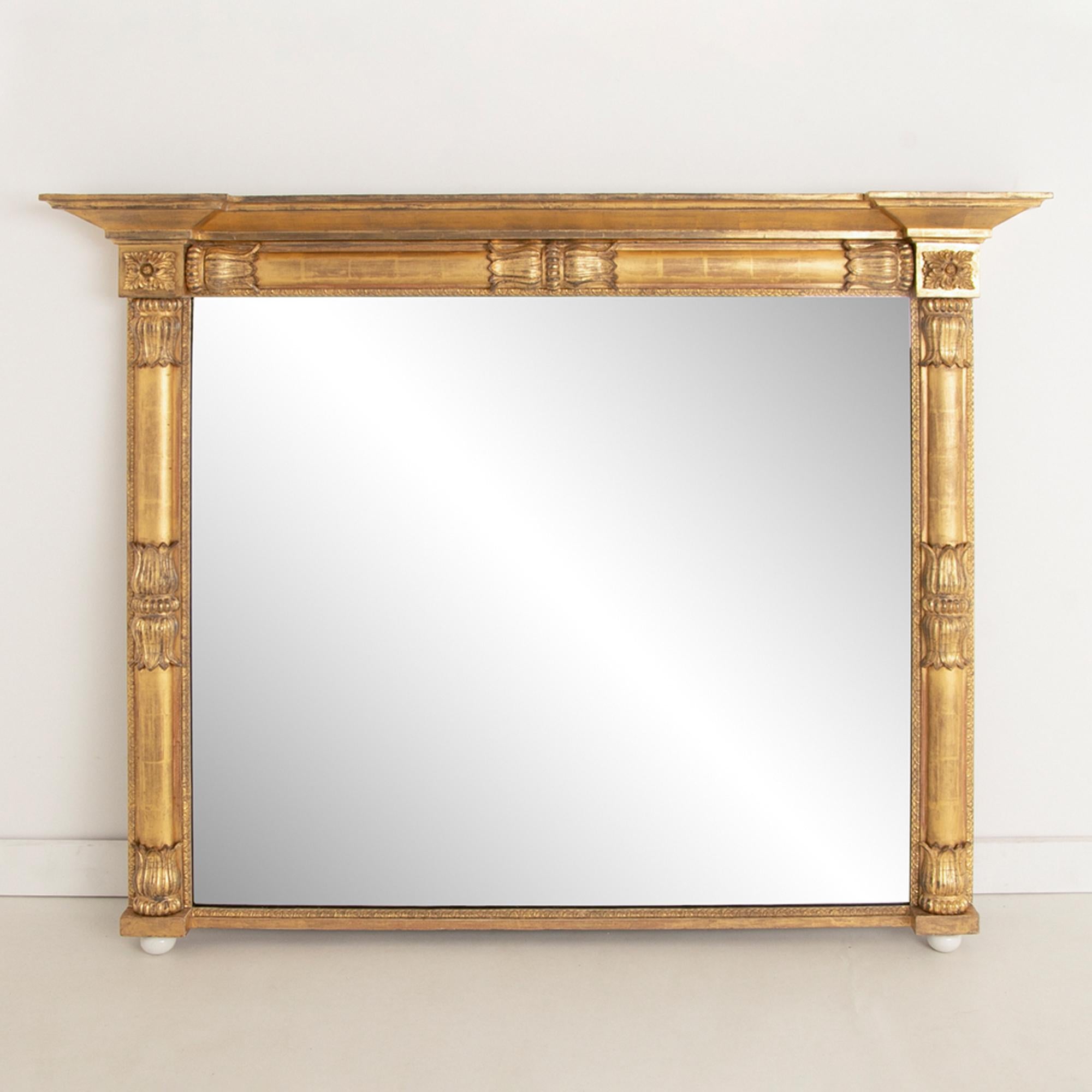 An antique Irish water gilded overmantle mirror with original mercury mirror plate and small areas of Foxing.

All our pieces are restored to the highest standards before sale. We use pure 23½ carat gold to refurbish gilded mirror frames.